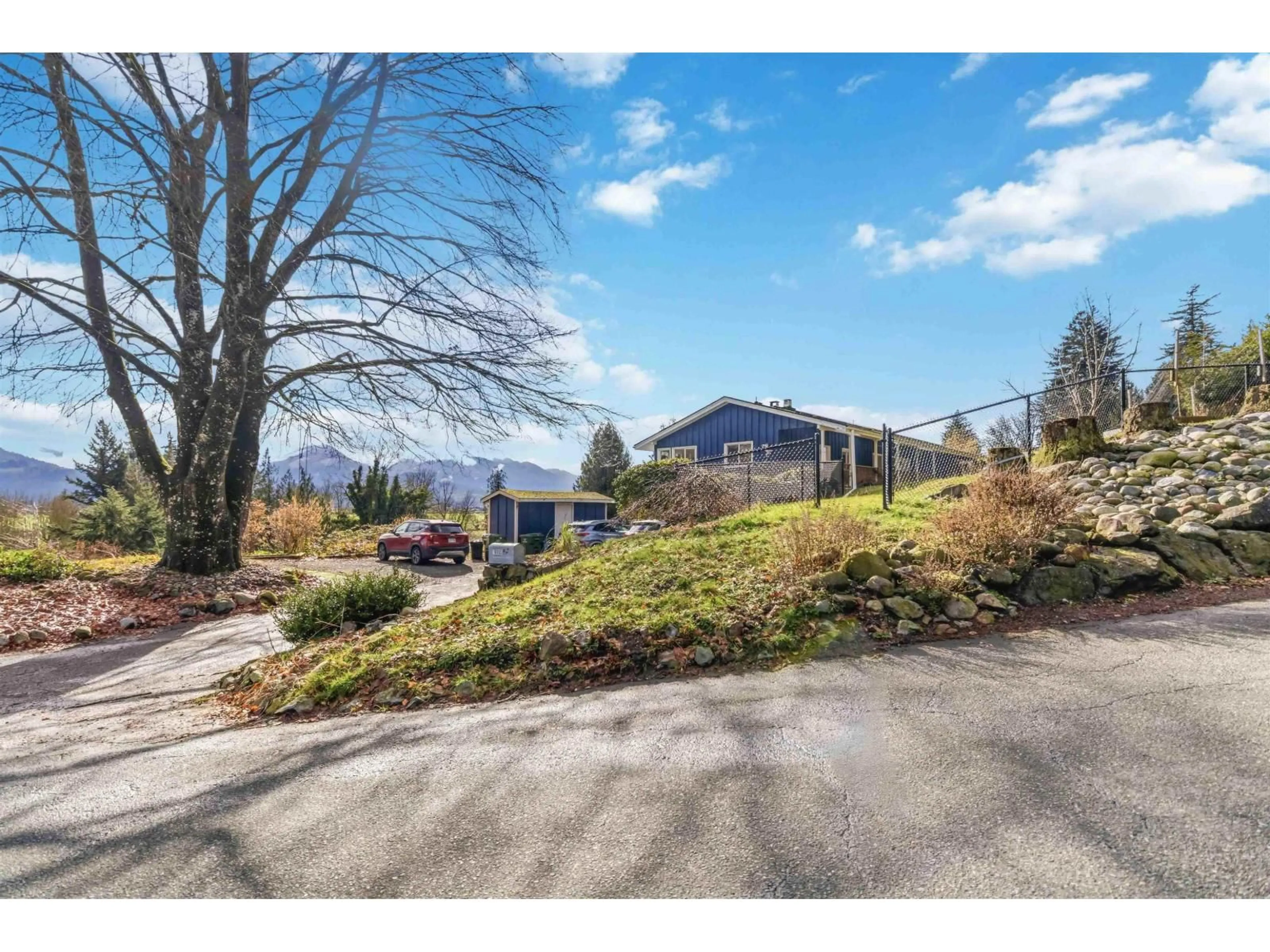 A pic from outside/outdoor area/front of a property/back of a property/a pic from drone, mountain view for 10005 KENSWOOD DRIVE, Chilliwack British Columbia V2P7N5