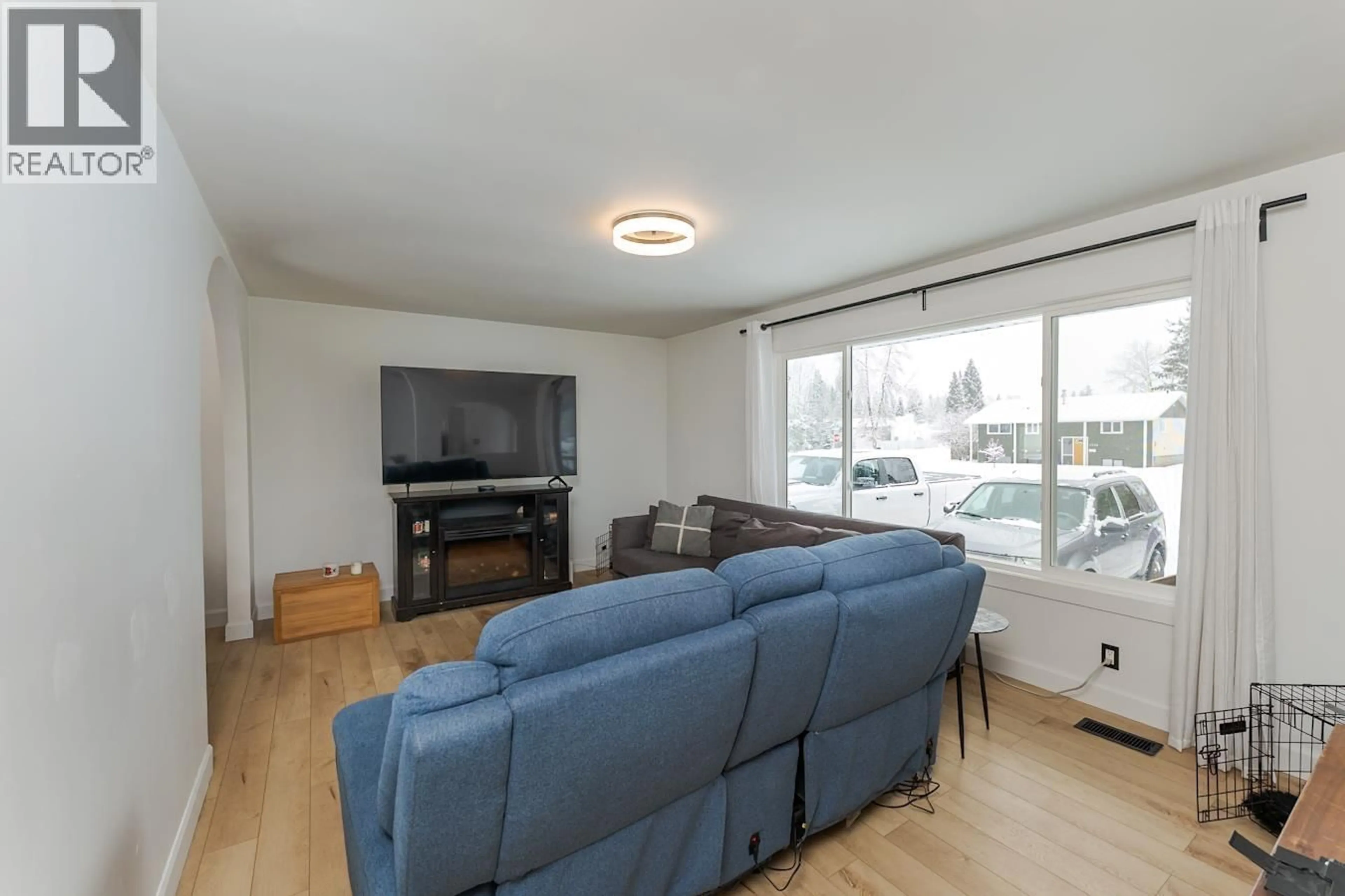 Living room with furniture, wood/laminate floor for 7759 OSGOODE DRIVE, Prince George British Columbia V2N3L8