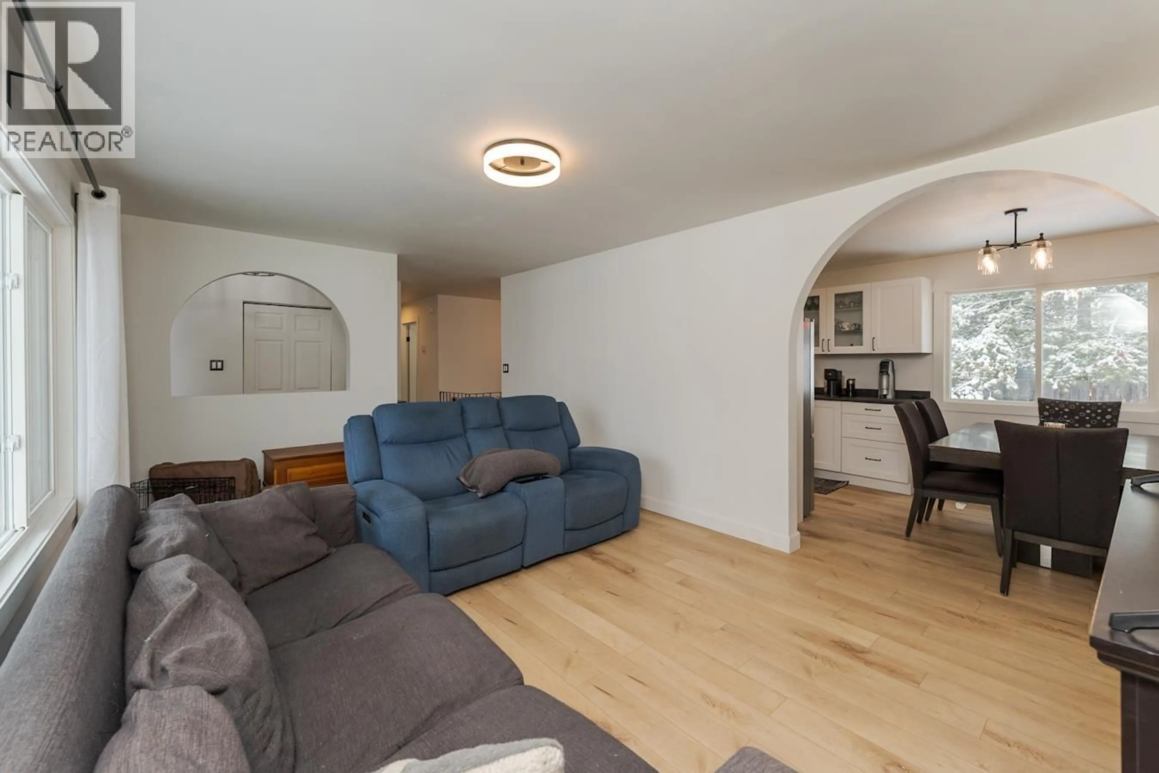 Living room with furniture, wood/laminate floor for 7759 OSGOODE DRIVE, Prince George British Columbia V2N3L8