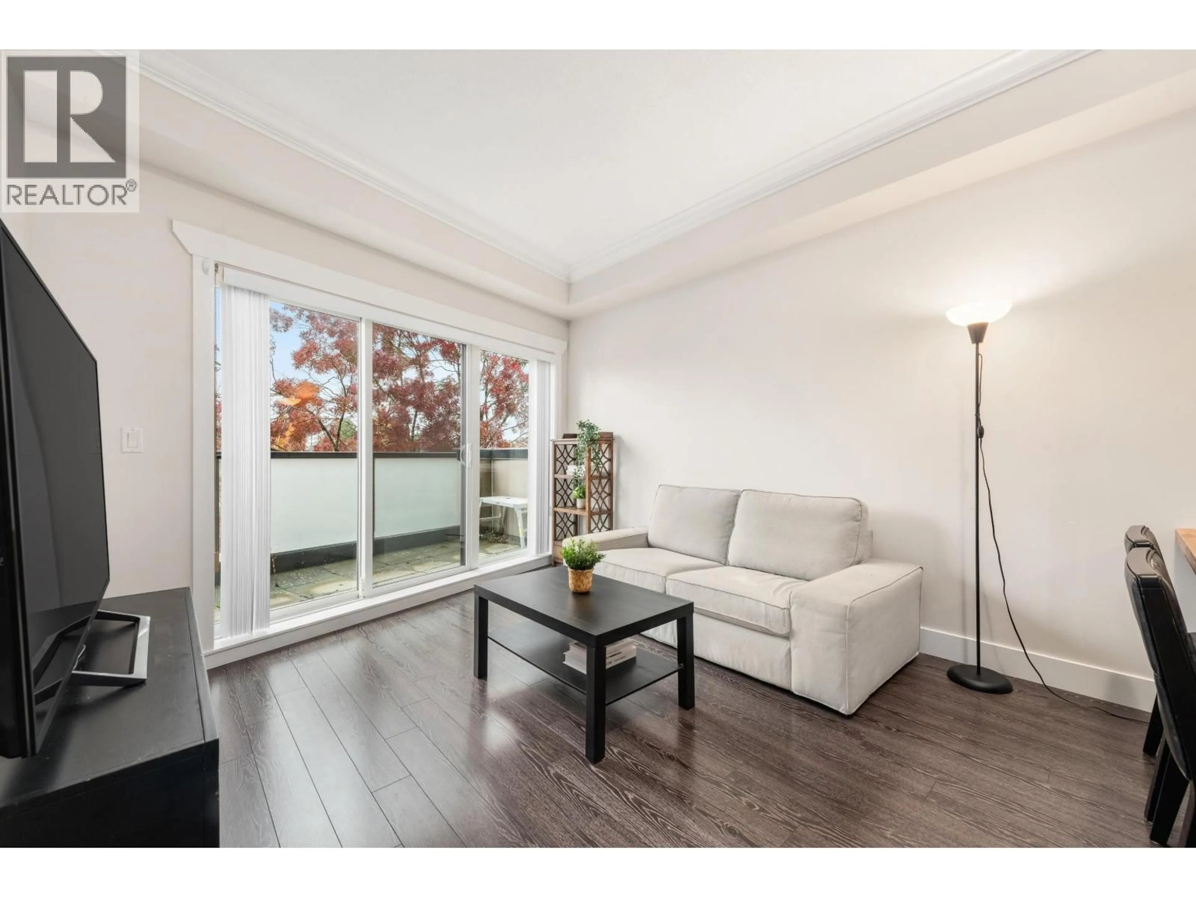 Living room with furniture, wood/laminate floor for 401 - 3437 KINGSWAY, Vancouver British Columbia V5R5L3
