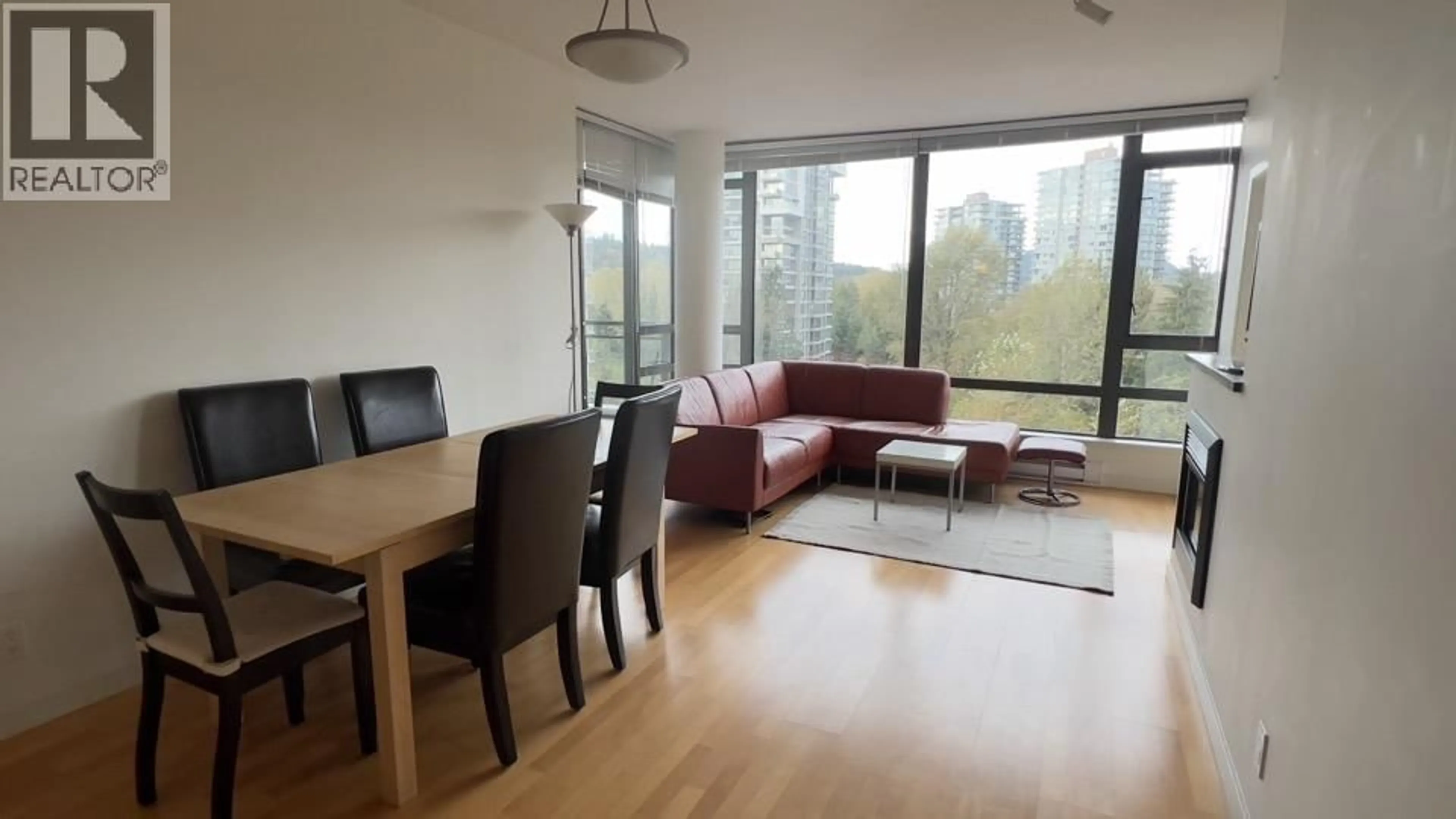Living room with furniture, wood/laminate floor for 705 - 400 CAPILANO ROAD, Port Moody British Columbia V3H0E1