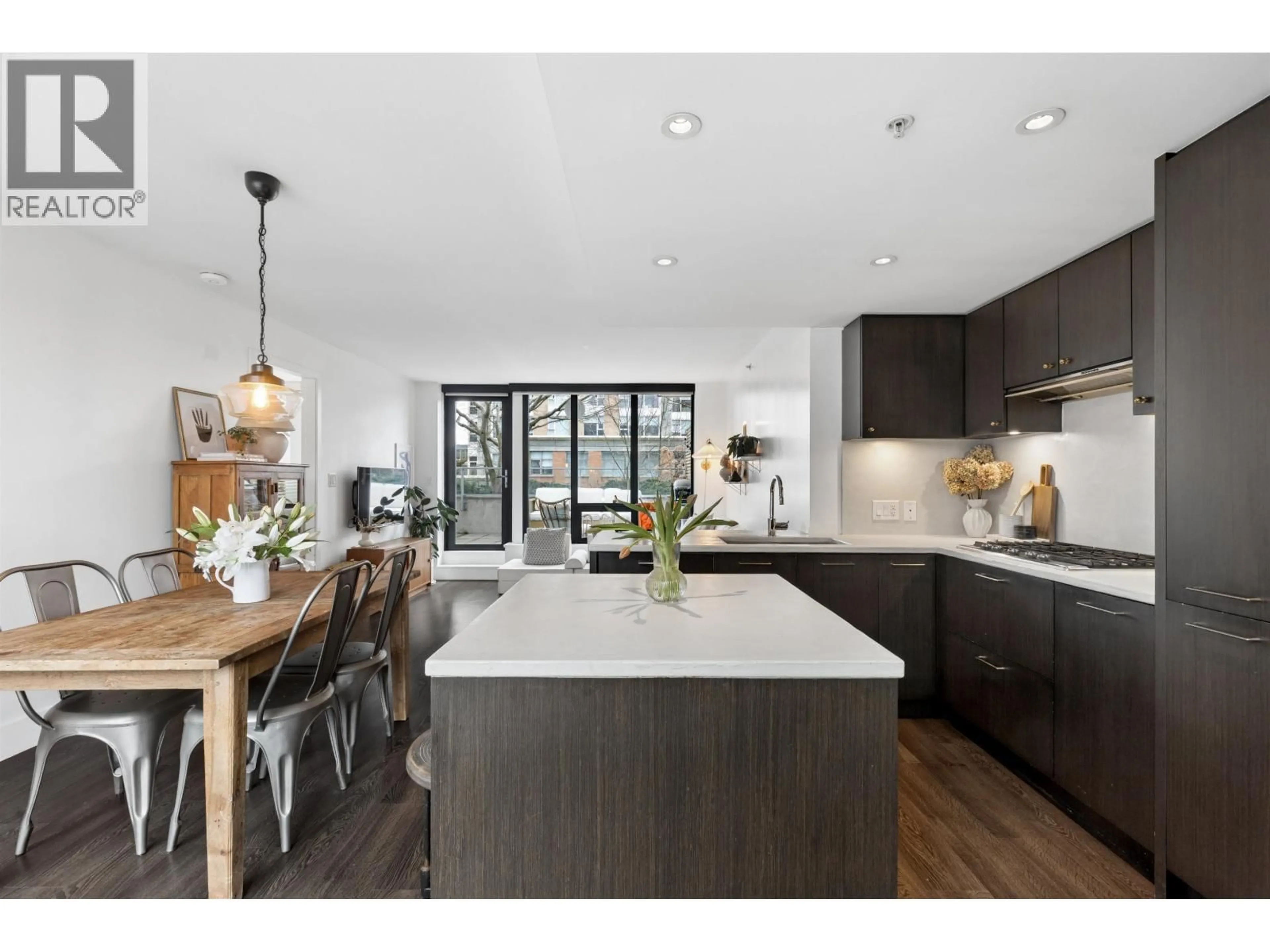 Open concept kitchen, wood/laminate floor for 303 - 150 15TH STREET, North Vancouver British Columbia V7M1R5