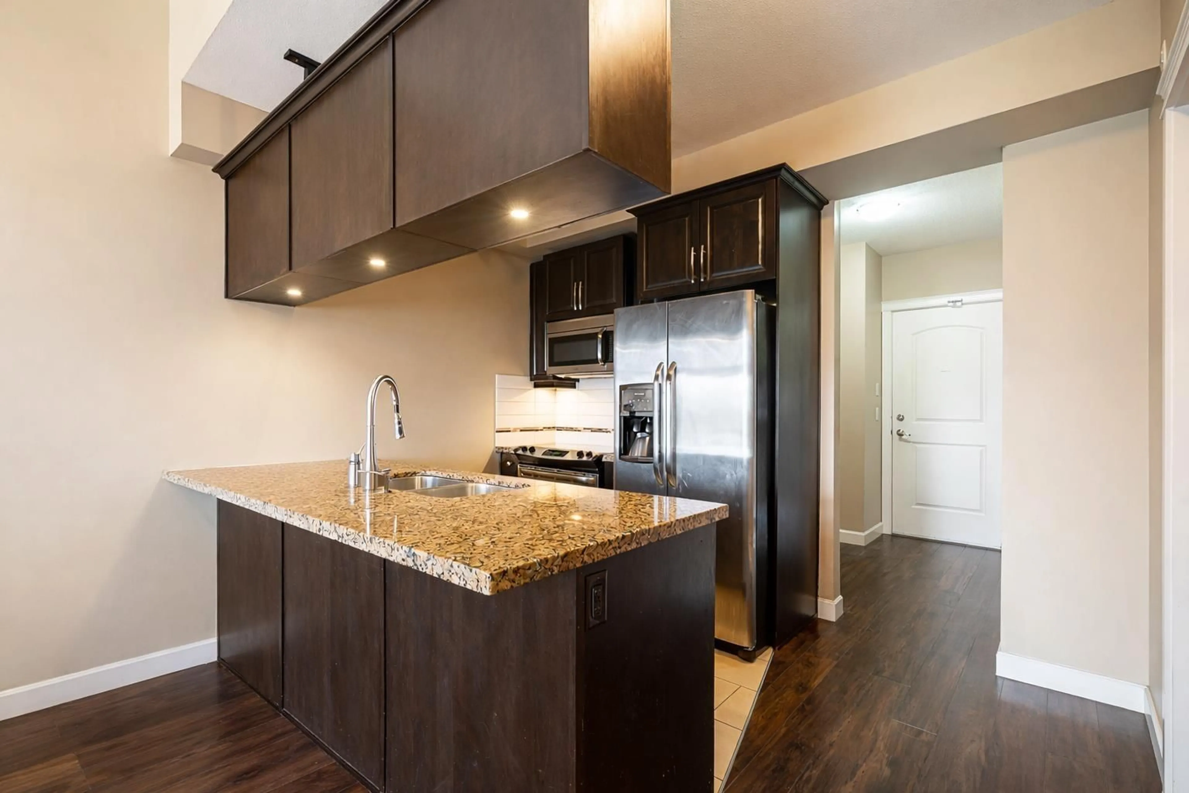 Open concept kitchen, wood/laminate floor for 417 - 8328 207A STREET, Langley British Columbia V2Y0K5