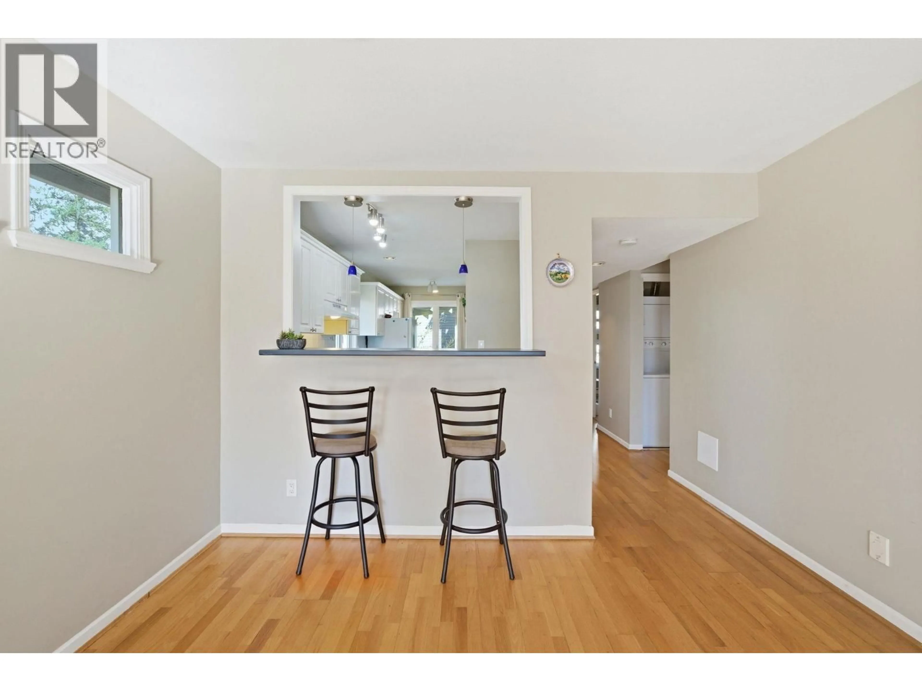 Open concept kitchen, wood/laminate floor for 203 - 1538 BOWSER AVENUE, North Vancouver British Columbia V7P2Y3