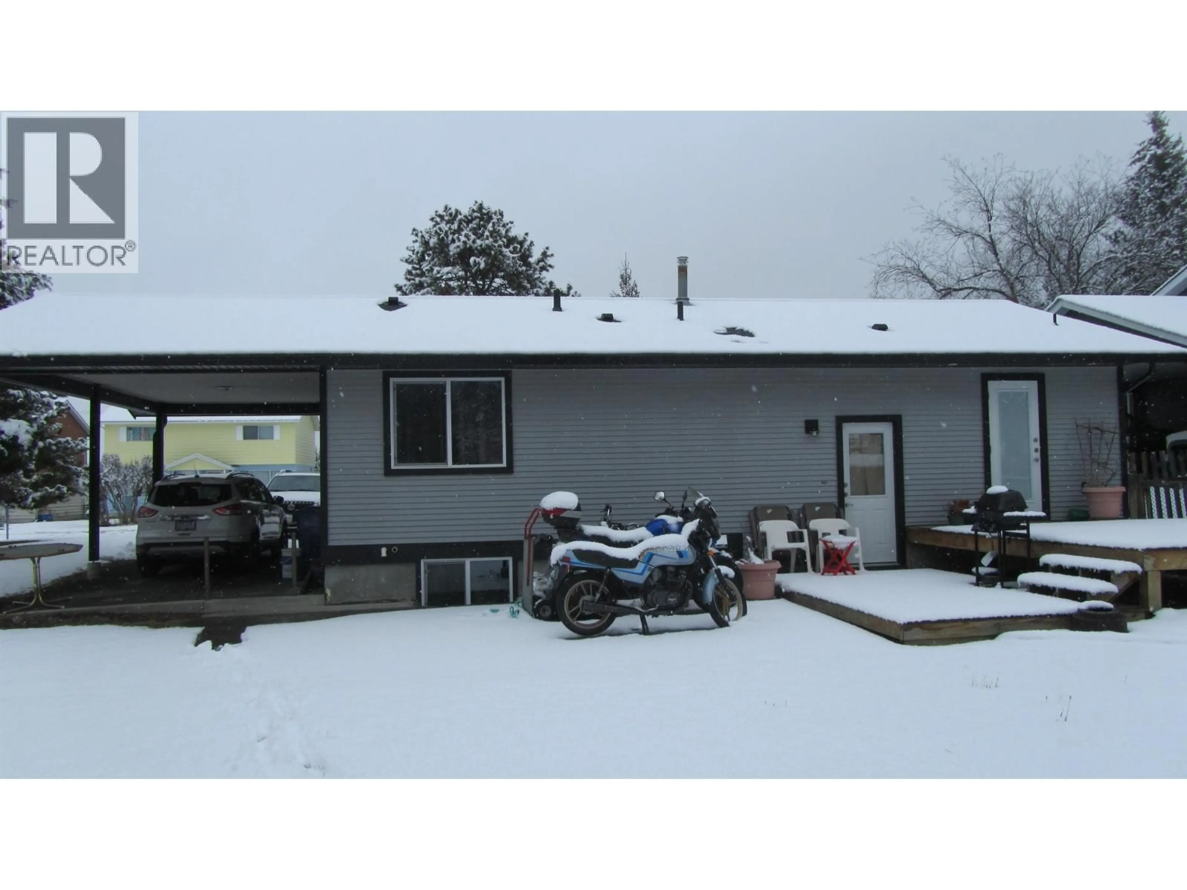A pic from outside/outdoor area/front of a property/back of a property/a pic from drone, unknown for 488 EVERGREEN CRESCENT, 100 Mile House British Columbia V0K2E0