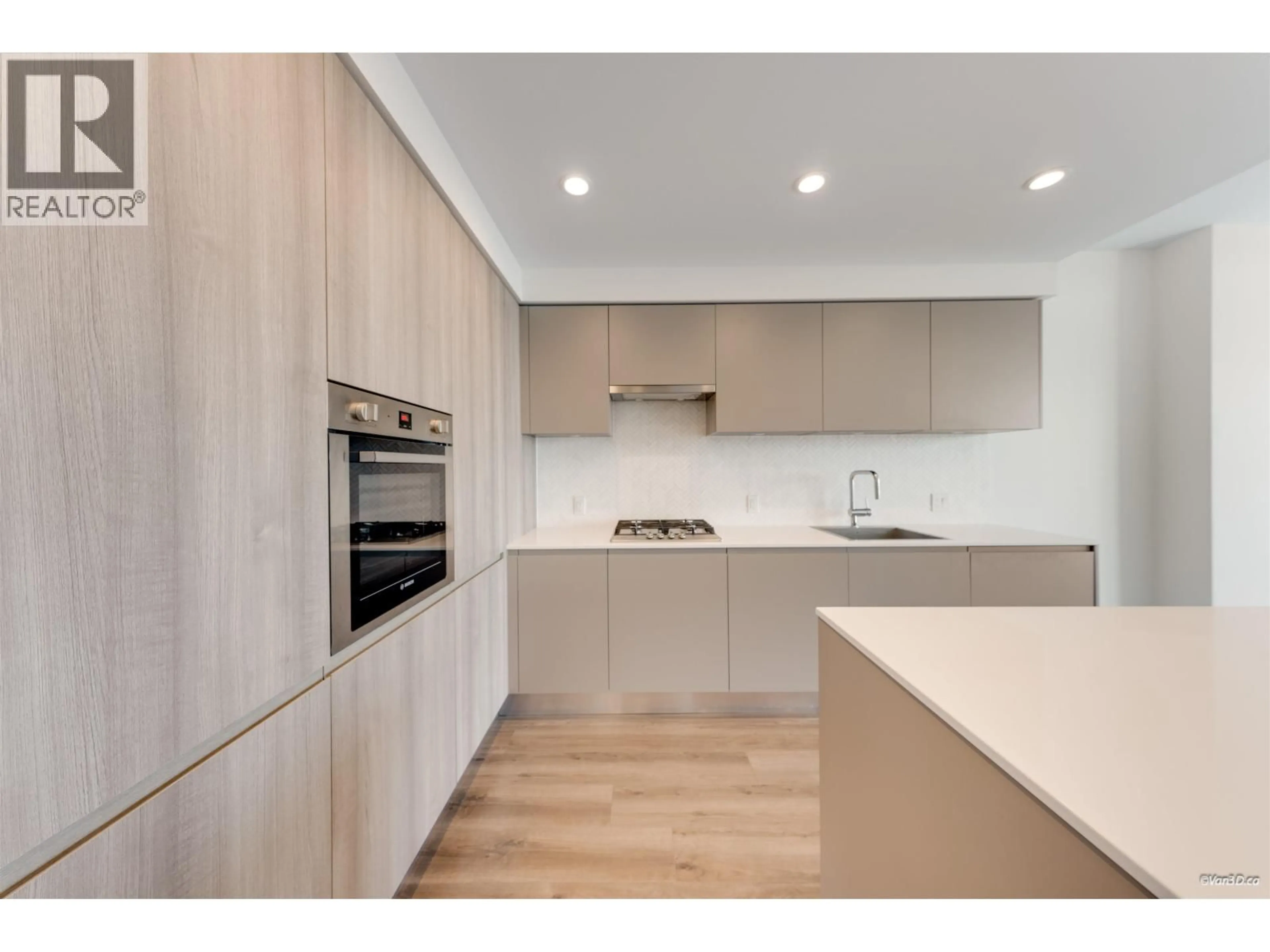 Open concept kitchen, wood/laminate floor for 3402 - 3809 EVERGREEN PLACE, Burnaby British Columbia V3J0M1