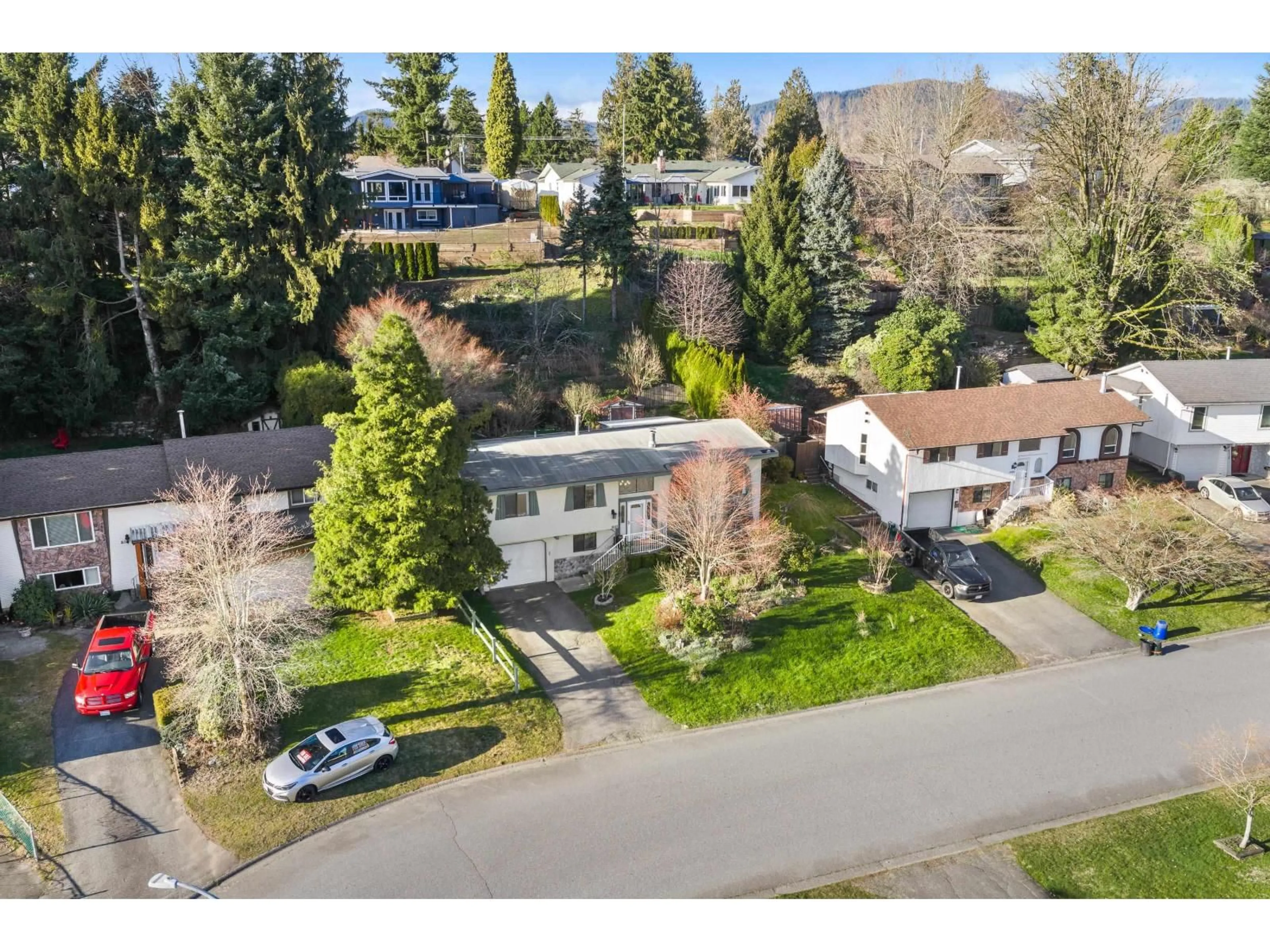 A pic from outside/outdoor area/front of a property/back of a property/a pic from drone, street for 8317 BLUEBERRY DRIVE, Mission British Columbia V2V5W4