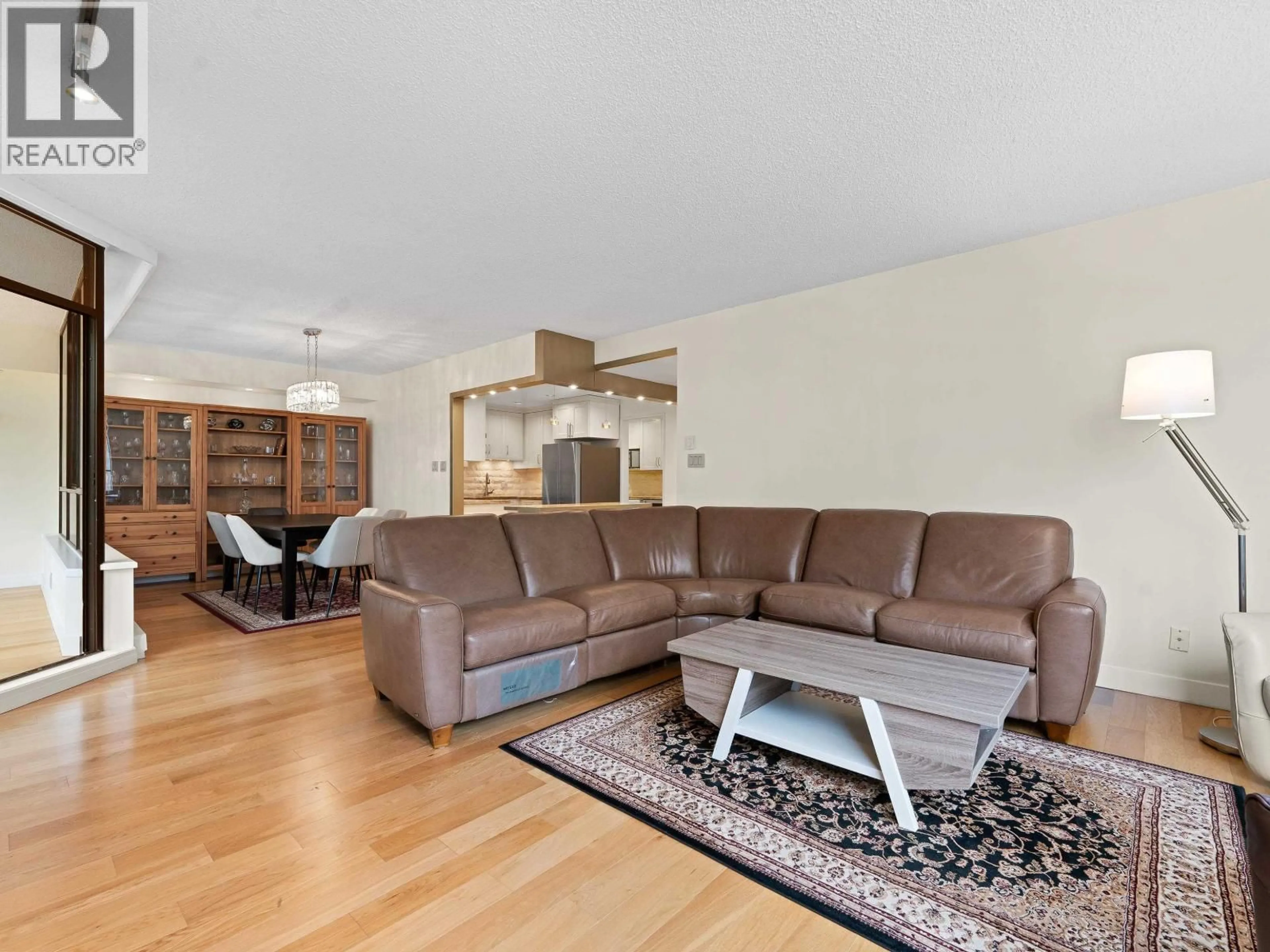 Living room with furniture, wood/laminate floor for 601 - 738 BROUGHTON STREET, Vancouver British Columbia V6G3A7