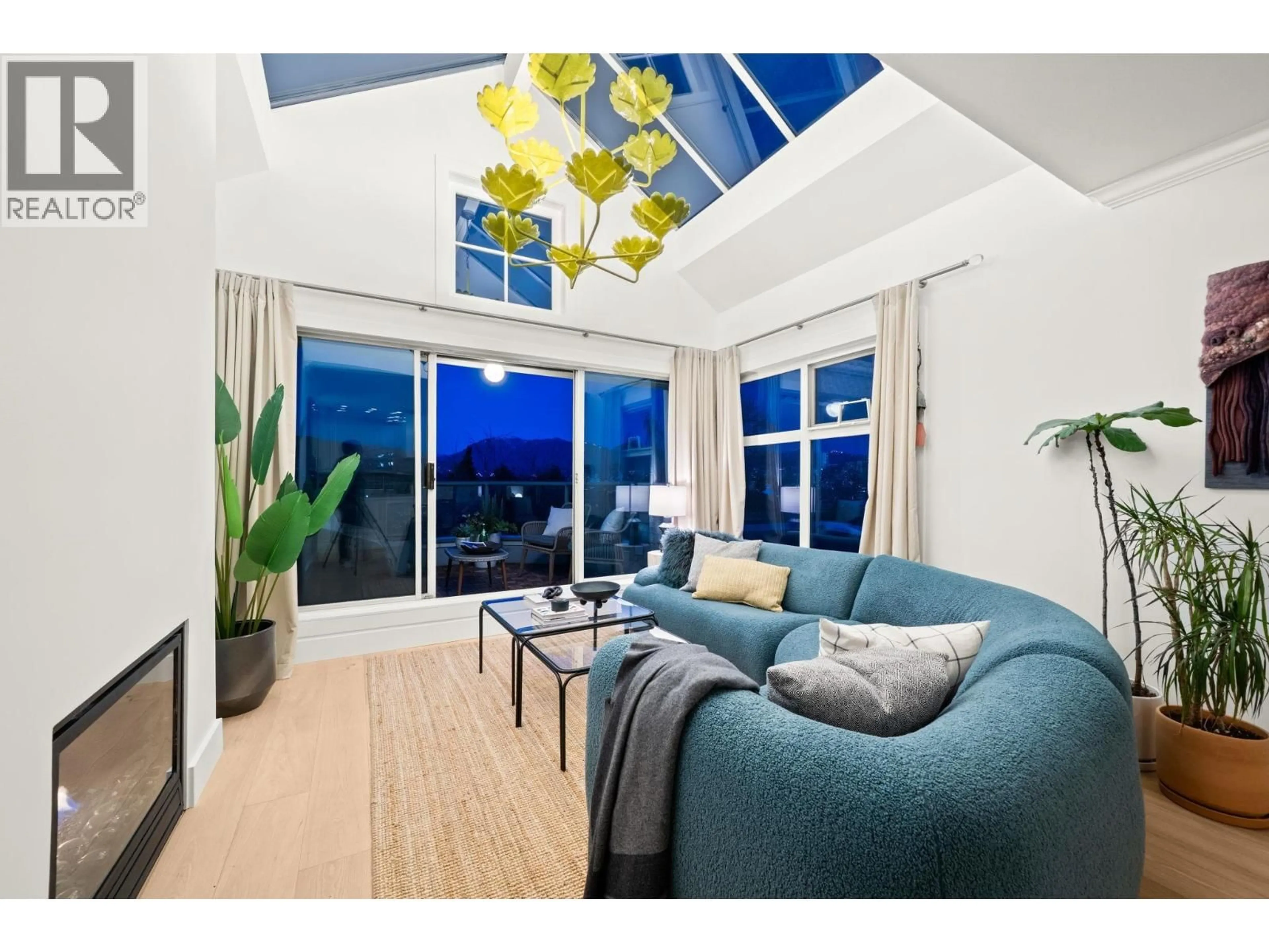 Living room with furniture, wood/laminate floor for 409 - 2250 3RD AVENUE, West Vancouver British Columbia V6K1L4