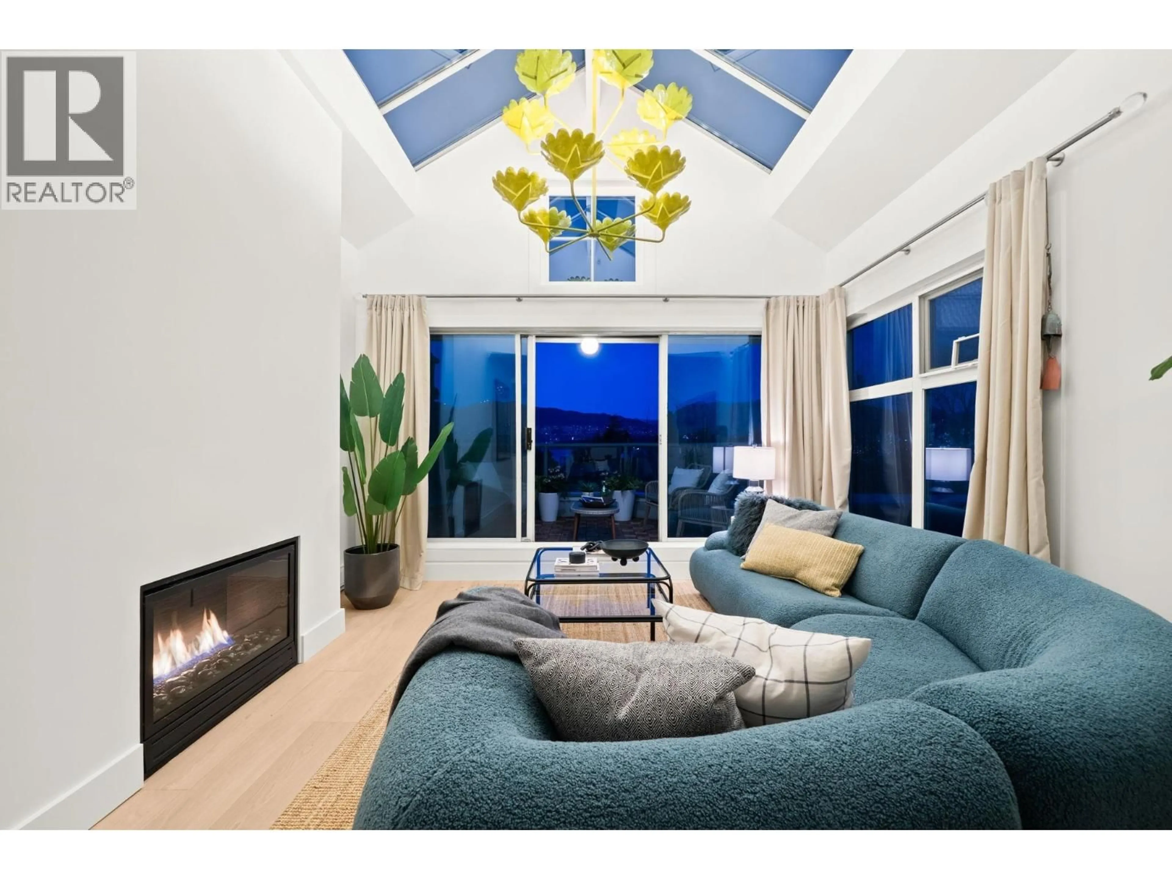 Living room with furniture, wood/laminate floor for 409 - 2250 3RD AVENUE, West Vancouver British Columbia V6K1L4