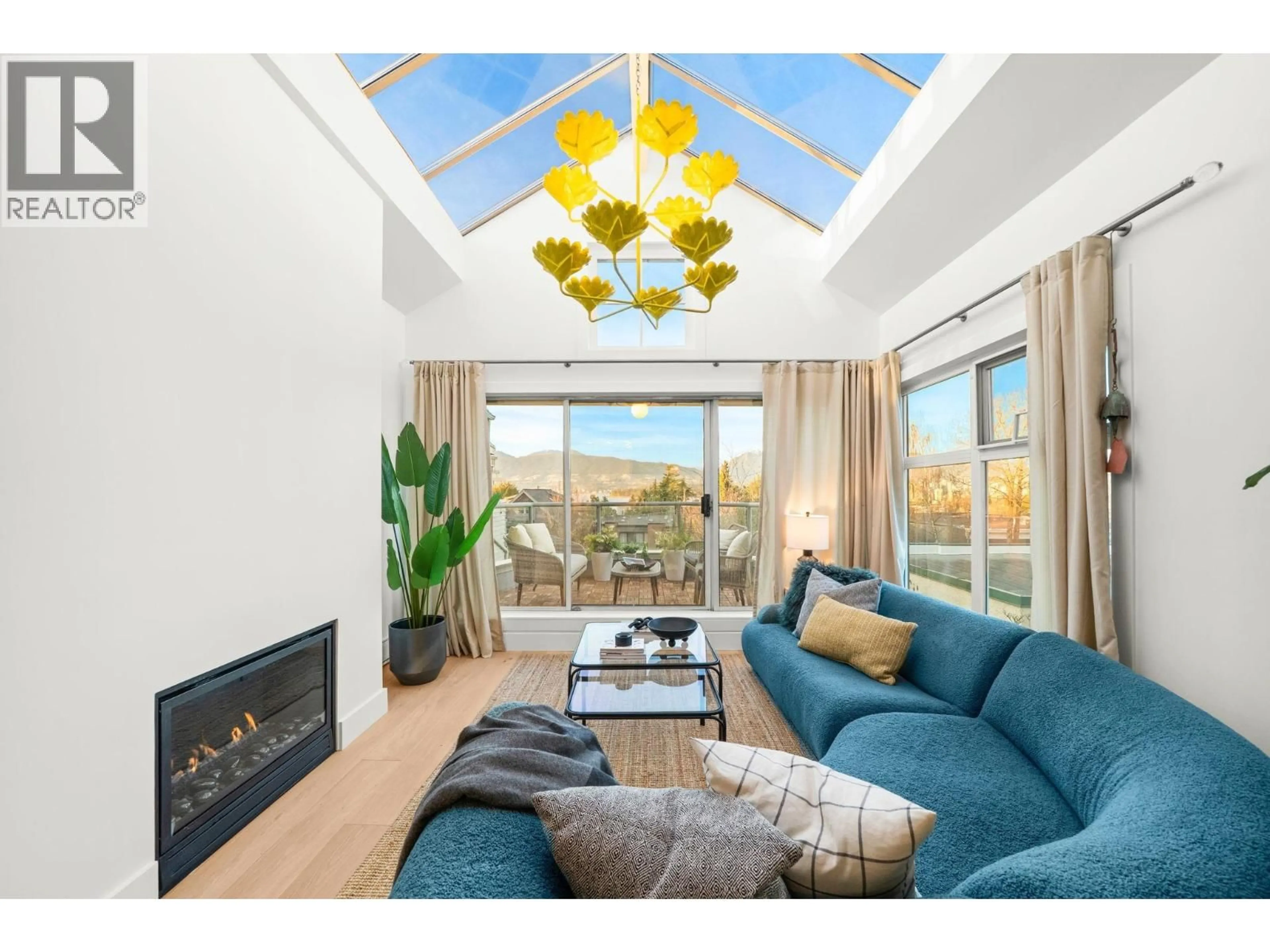 Living room with furniture, wood/laminate floor for 409 - 2250 3RD AVENUE, West Vancouver British Columbia V6K1L4