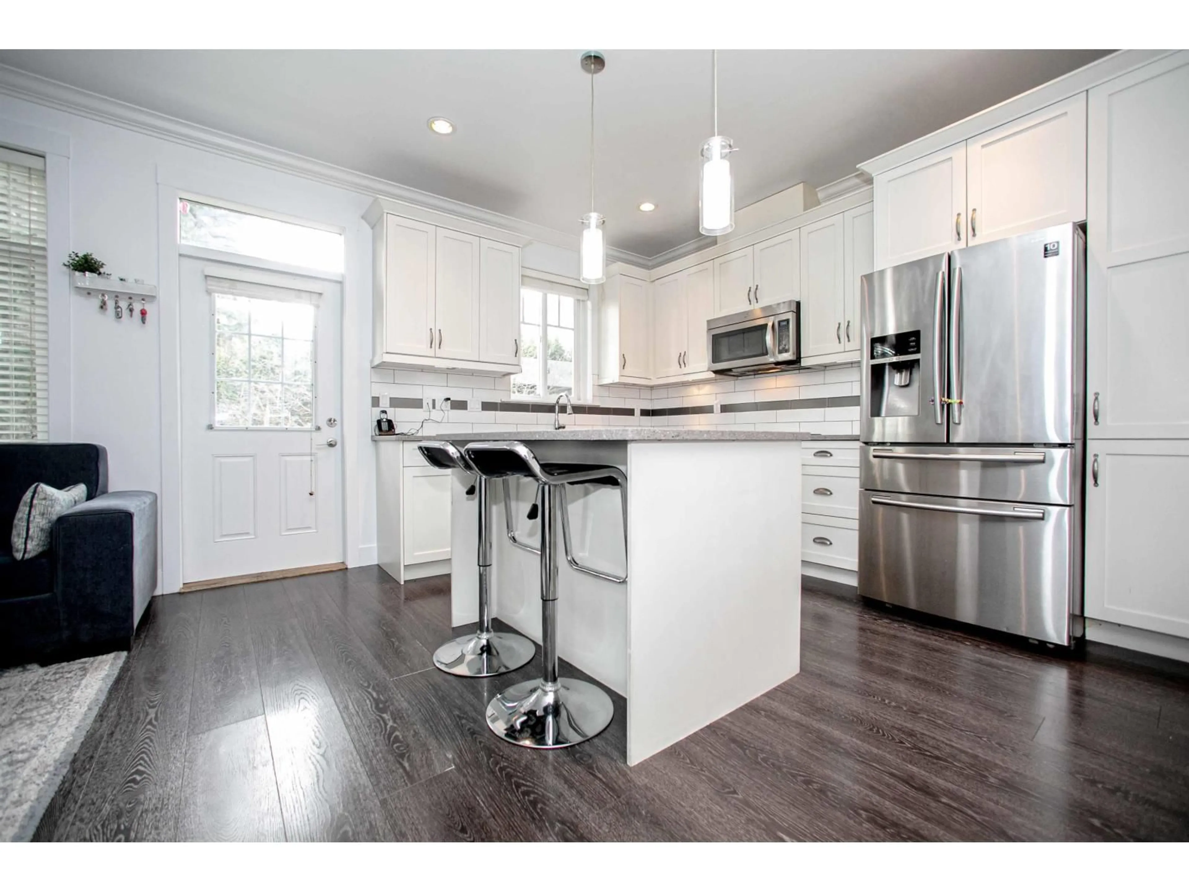 Open concept kitchen, wood/laminate floor for 19 - 6929 142 STREET, Surrey British Columbia V3W5N1