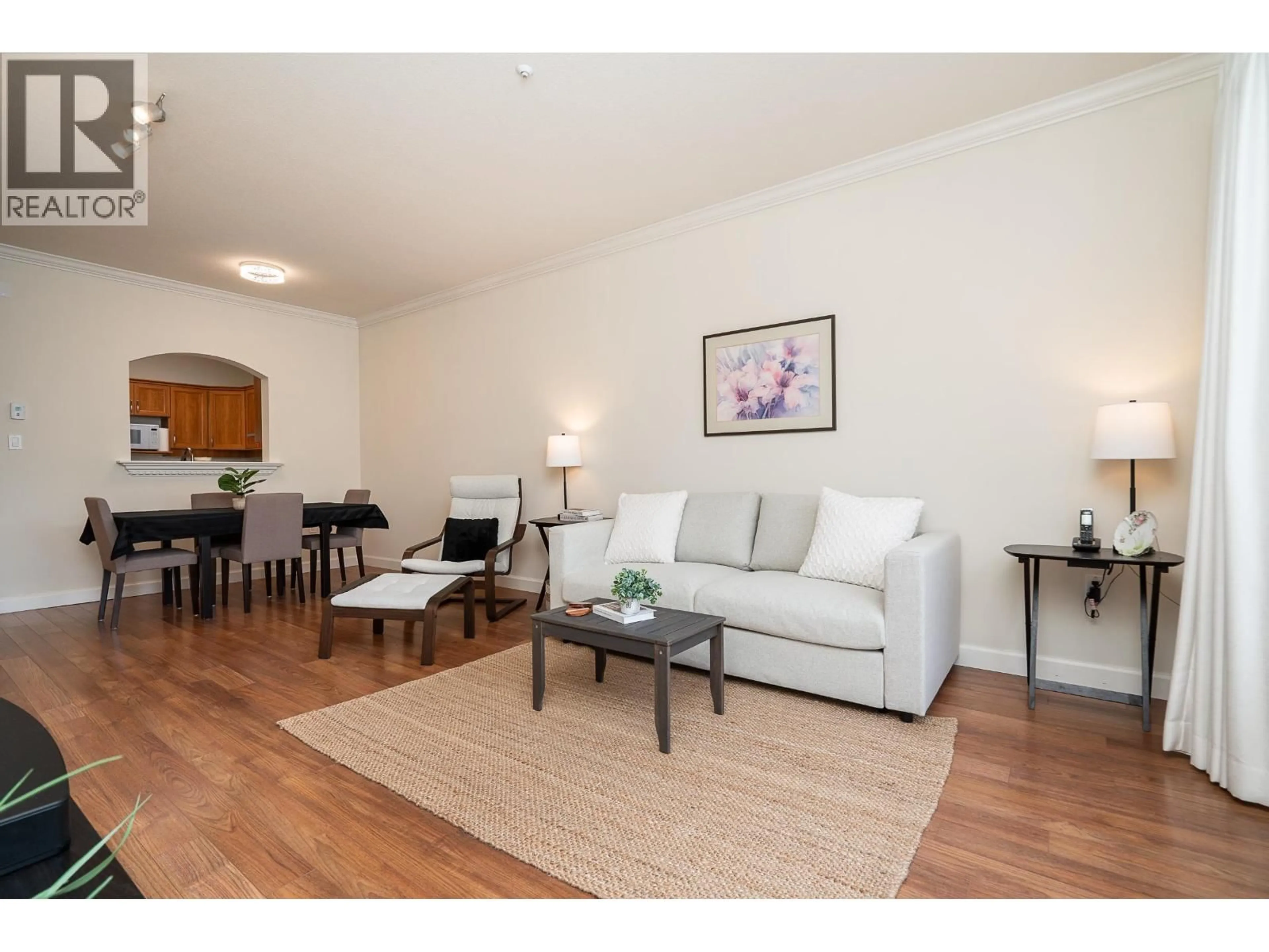 Living room with furniture, wood/laminate floor for 318 - 2985 PRINCESS CRESCENT, Coquitlam British Columbia V3B7P3
