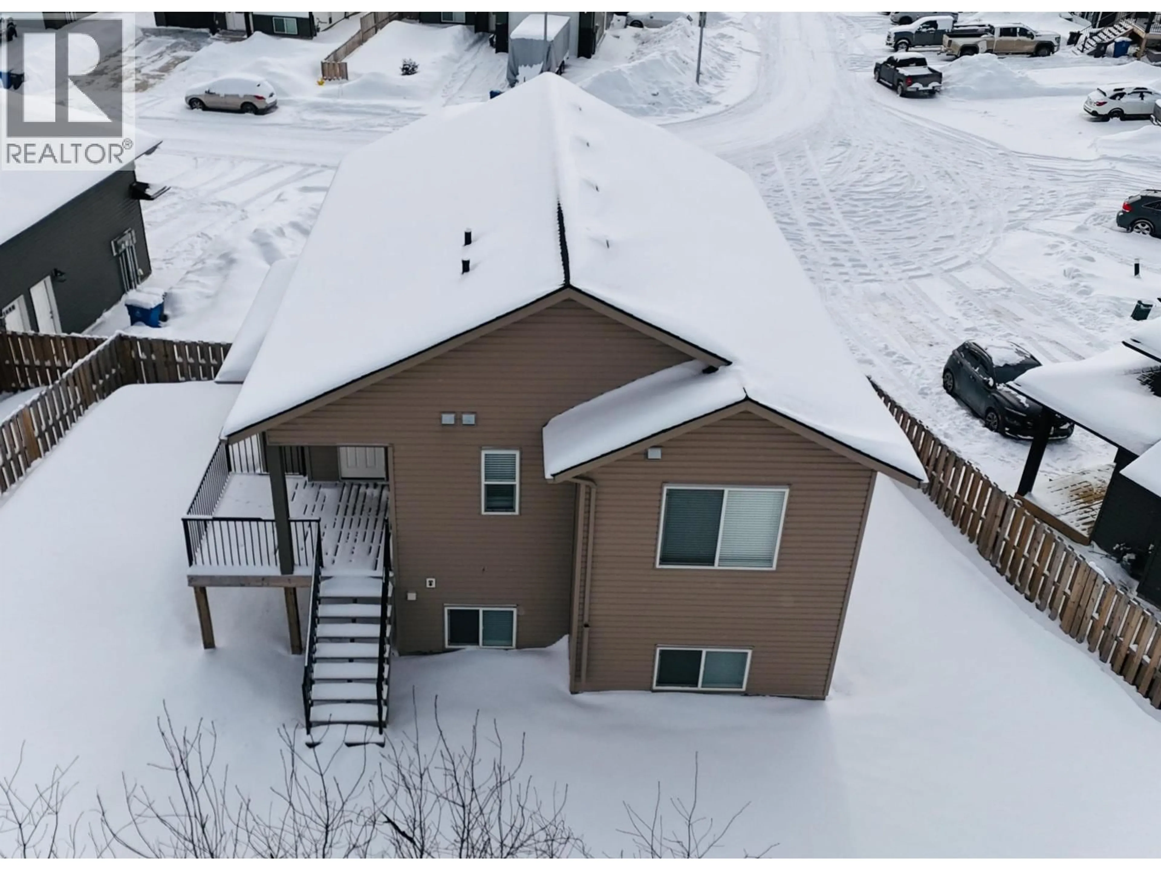 A pic from outside/outdoor area/front of a property/back of a property/a pic from drone, unknown for 8424 88 AVENUE, Fort St. John British Columbia V1J0S2