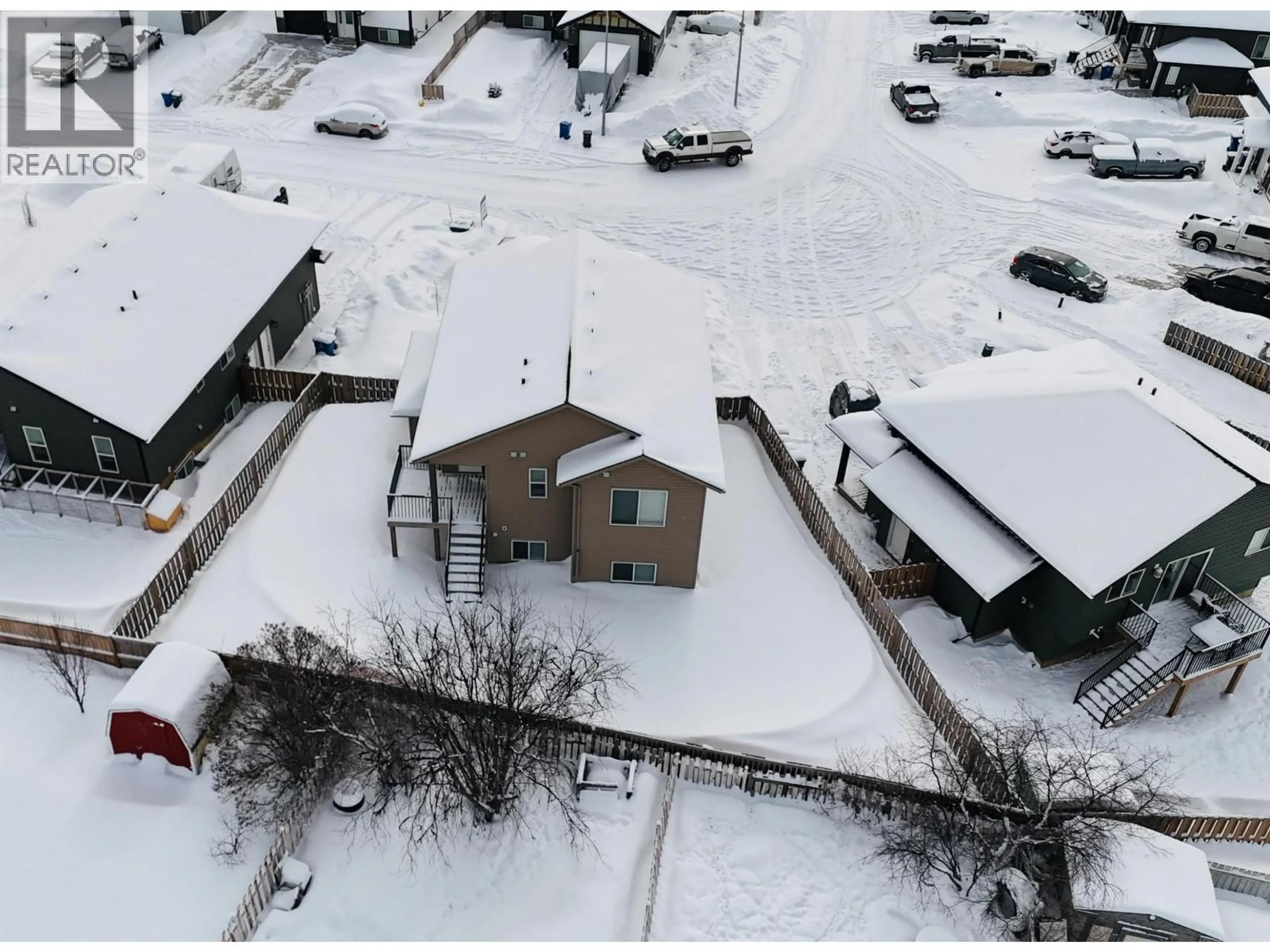 A pic from outside/outdoor area/front of a property/back of a property/a pic from drone, building for 8424 88 AVENUE, Fort St. John British Columbia V1J0S2