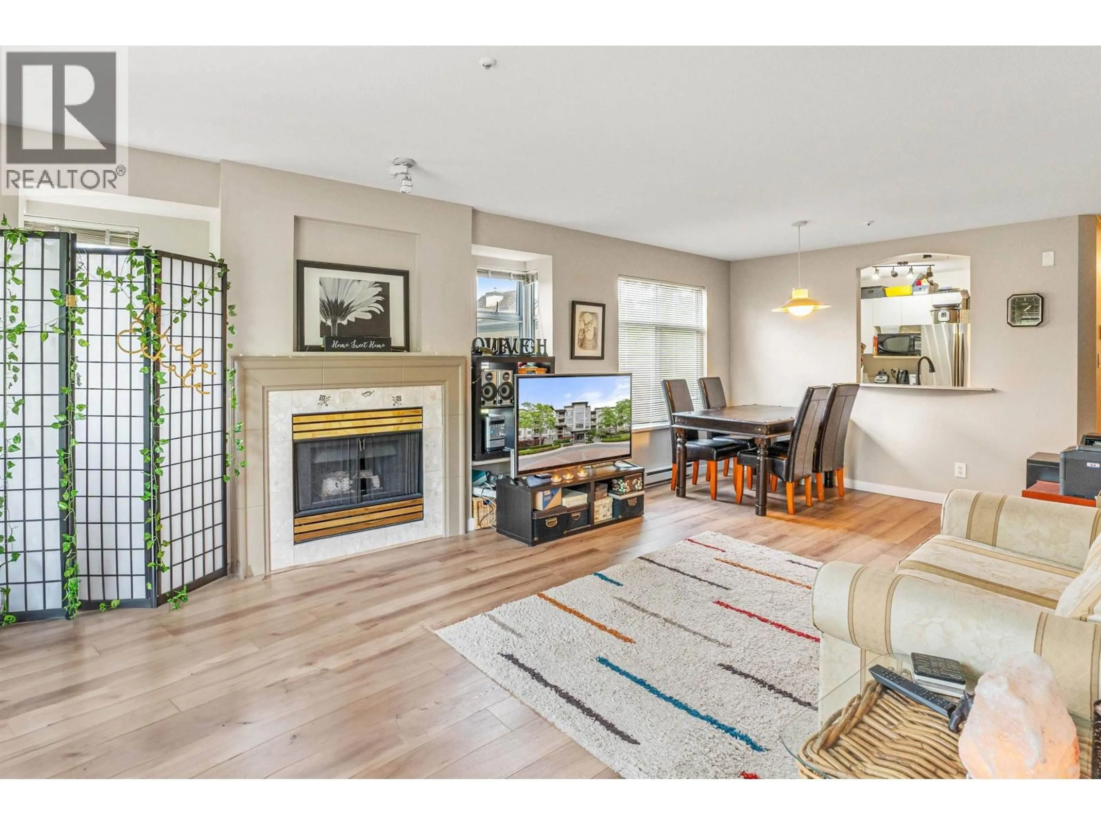 Living room with furniture, wood/laminate floor for 216 - 8220 JONES ROAD, Richmond British Columbia V6Y3Z7