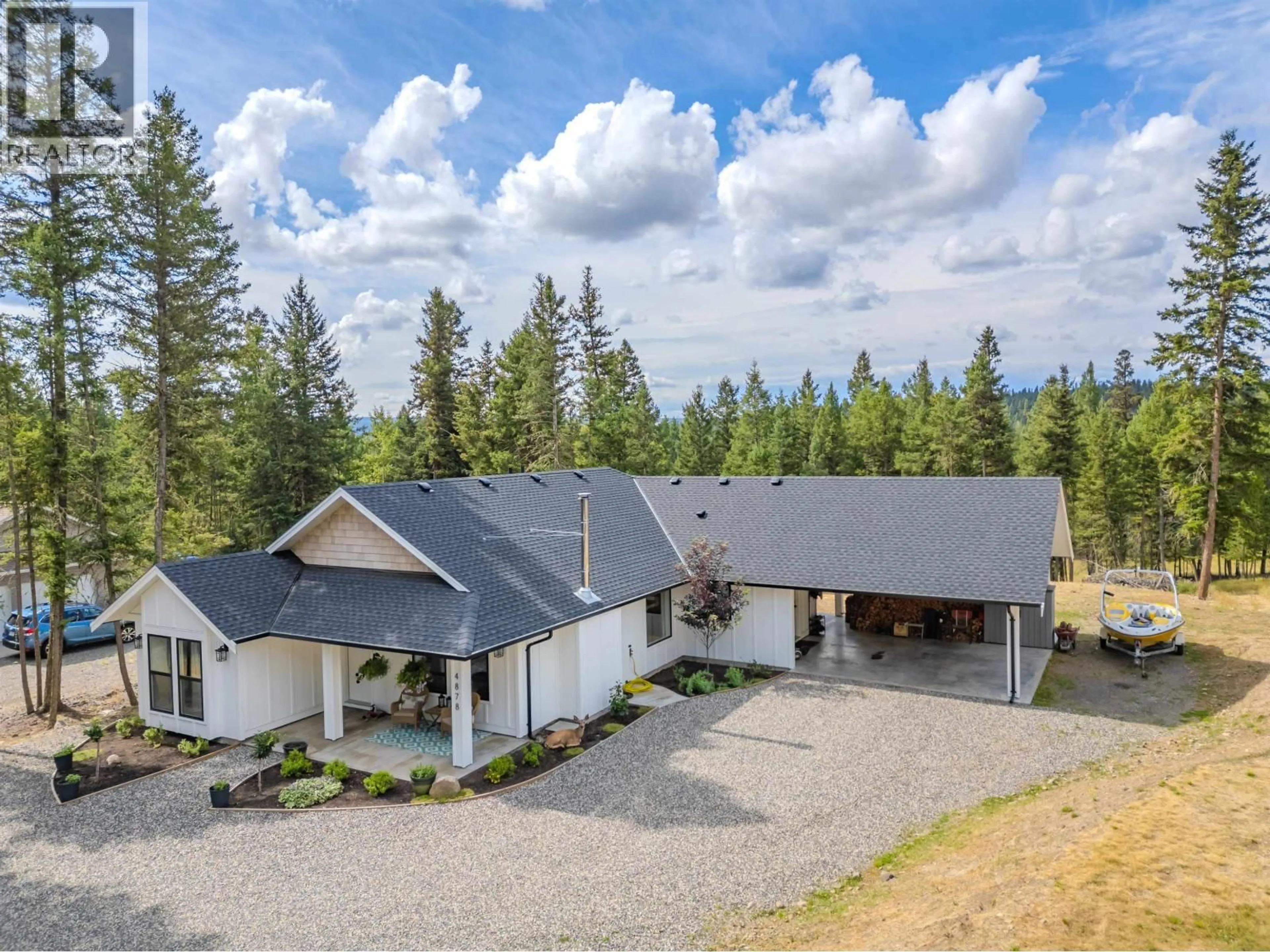 A pic from outside/outdoor area/front of a property/back of a property/a pic from drone, mountain view for 4878 GLOINNZUN DRIVE, 108 Mile Ranch British Columbia V0K2Z0