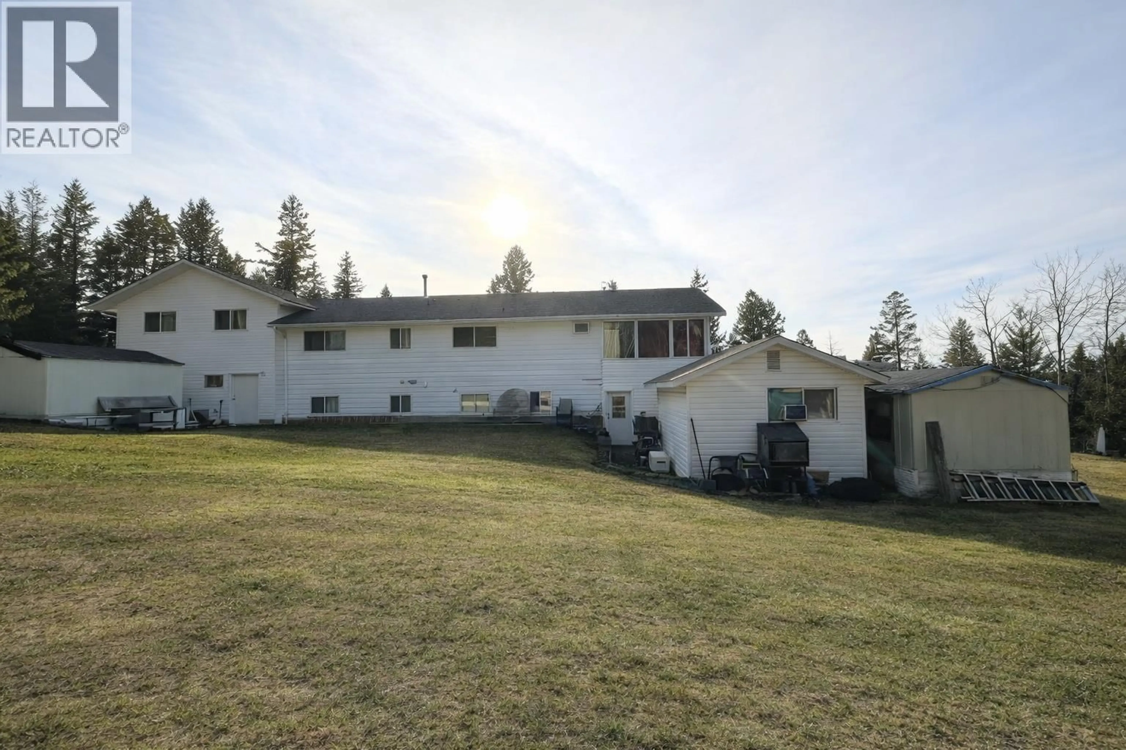 A pic from outside/outdoor area/front of a property/back of a property/a pic from drone, mountain view for 4765 TELQUA DRIVE, 108 Mile Ranch British Columbia V0K2Z0