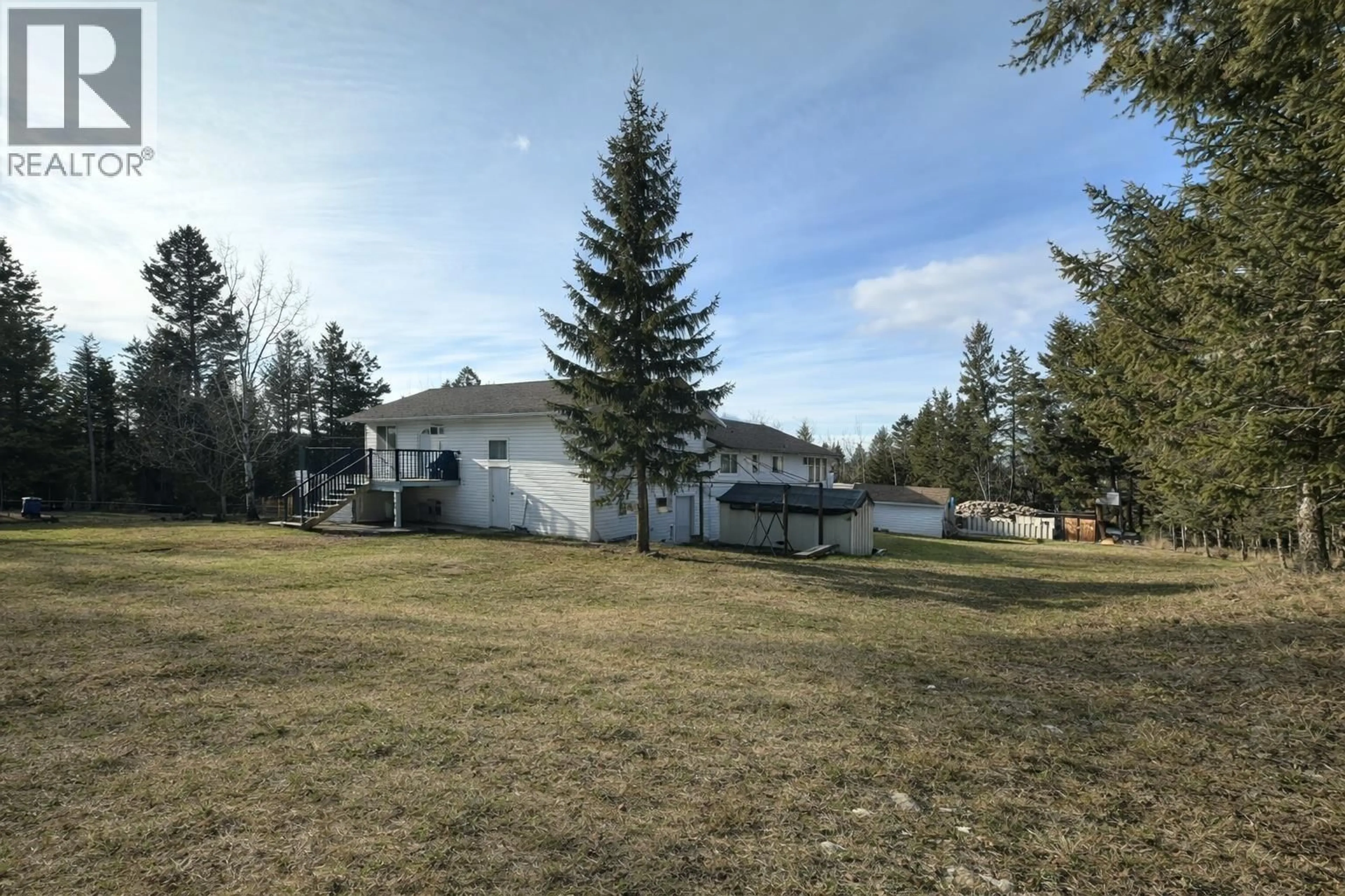 A pic from outside/outdoor area/front of a property/back of a property/a pic from drone, mountain view for 4765 TELQUA DRIVE, 108 Mile Ranch British Columbia V0K2Z0