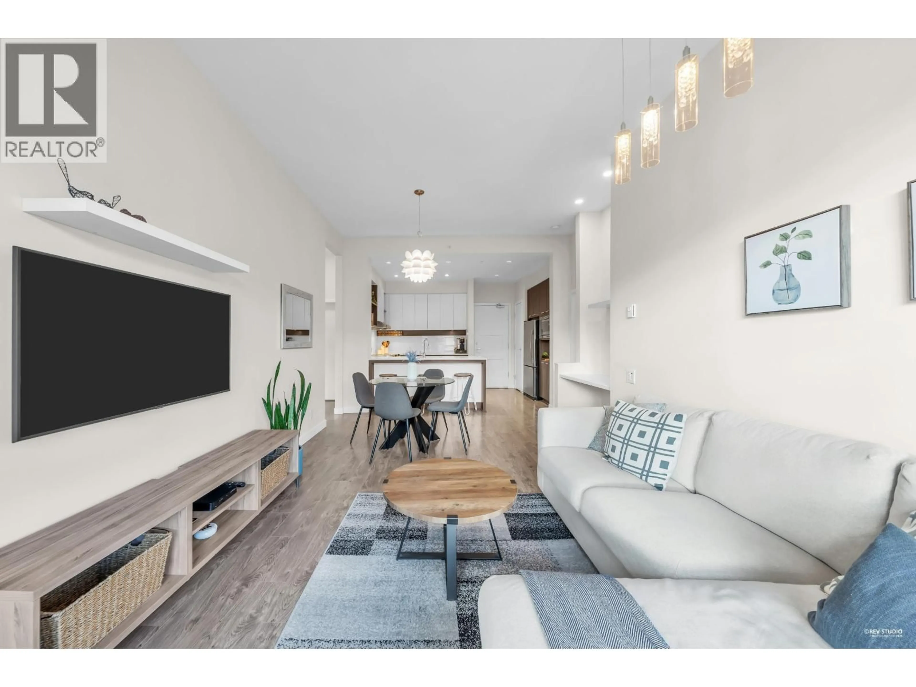 Living room with furniture, wood/laminate floor for 412 - 545 FOSTER AVENUE, Coquitlam British Columbia V3J0B3