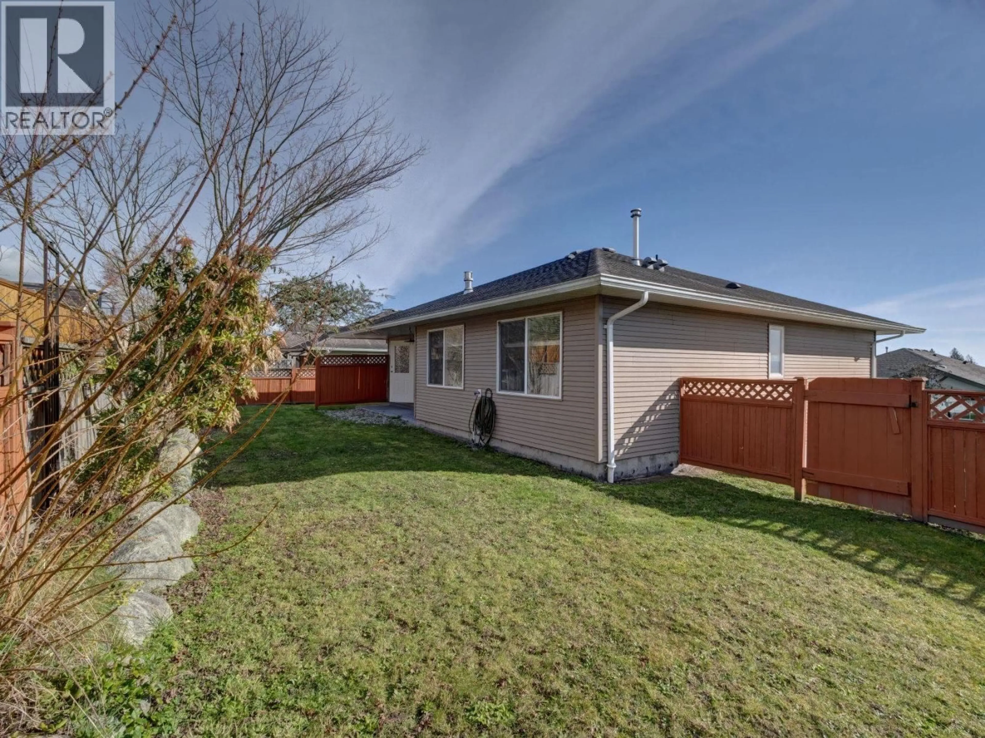 A pic from outside/outdoor area/front of a property/back of a property/a pic from drone, street for 5683 EMILY WAY, Sechelt British Columbia V7Z0N5