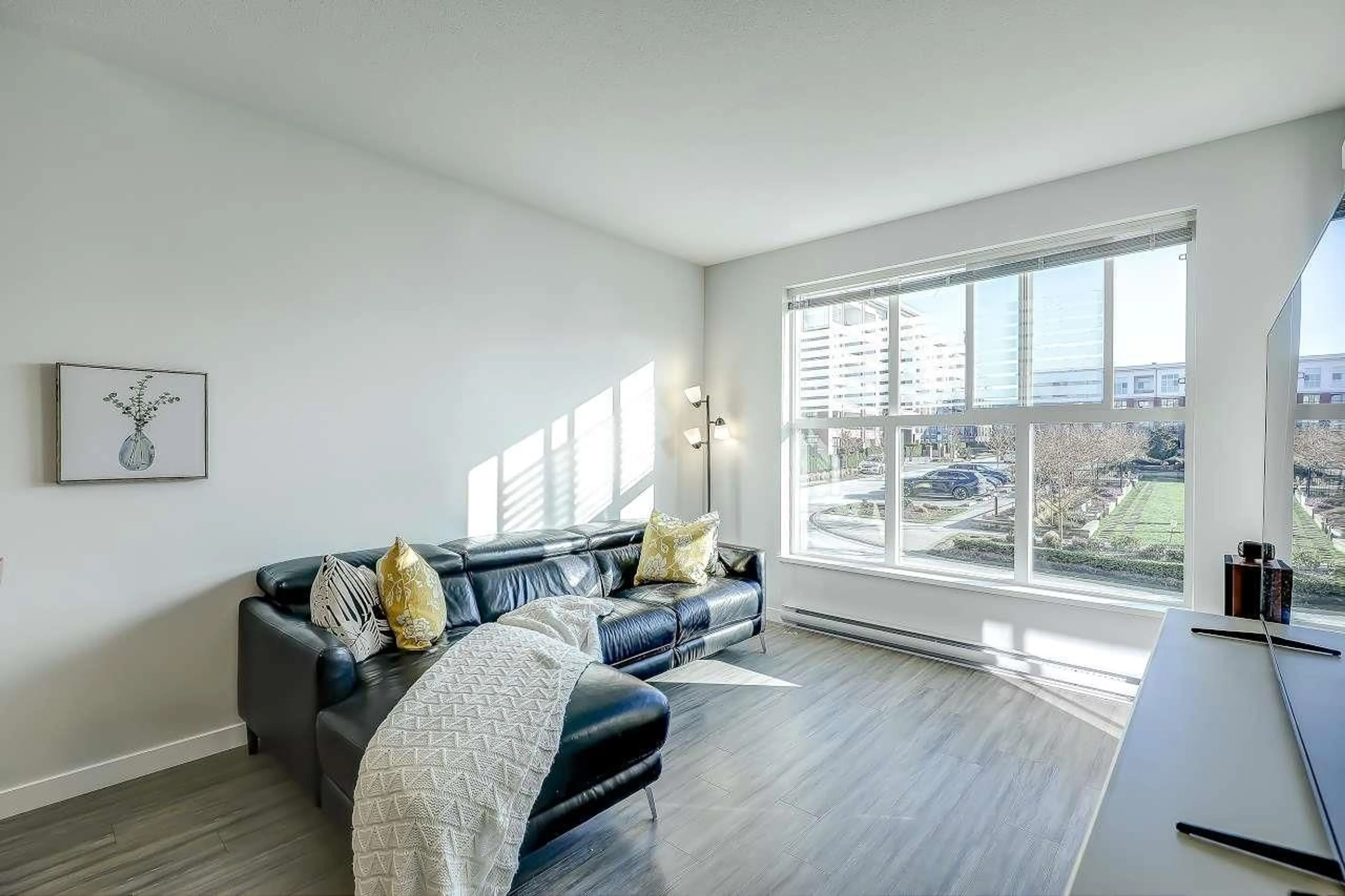 Living room with furniture, wood/laminate floor for b220 - 8150 207 STREET, Langley British Columbia V2Y4J3