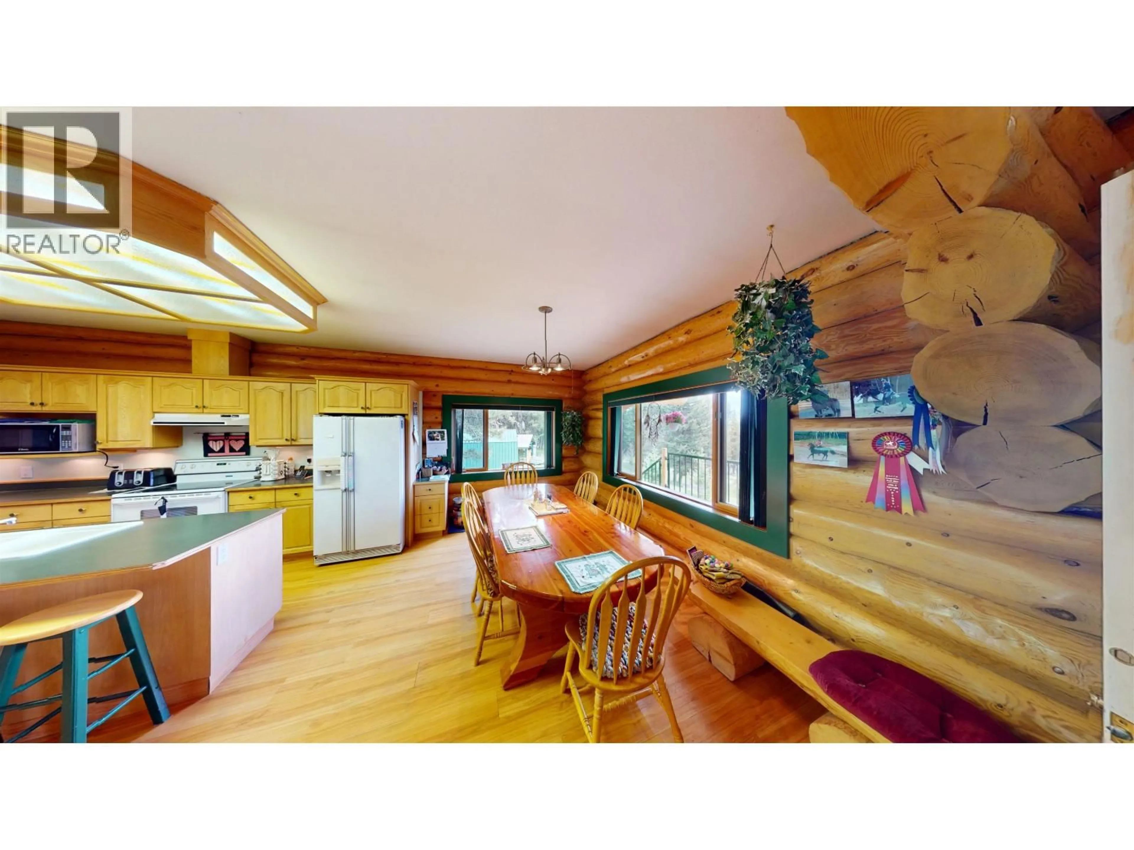 Open concept kitchen, wood/laminate floor for 6344 HIGHLAND CRESCENT, 100 Mile House British Columbia V0K2E3