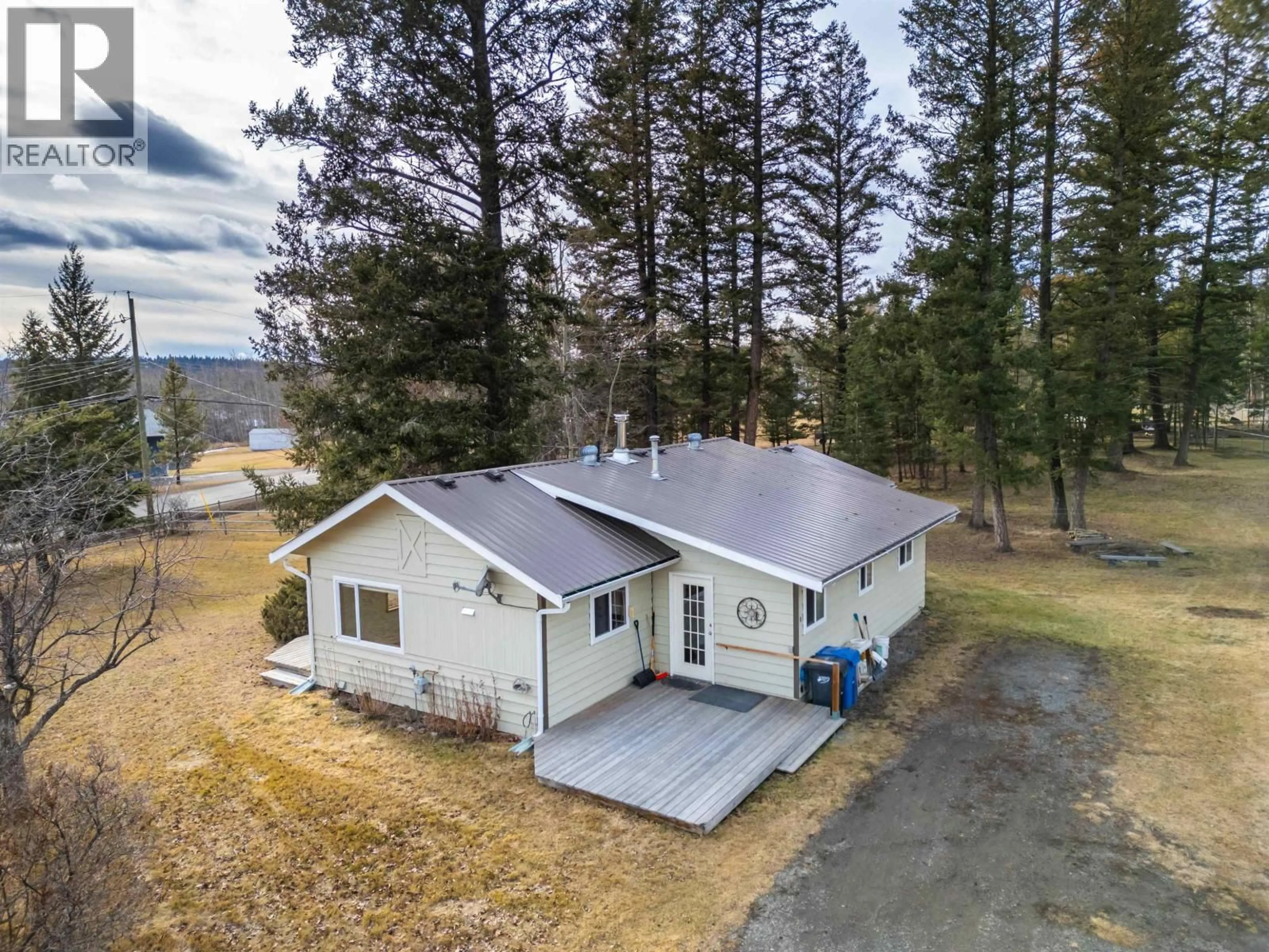 A pic from outside/outdoor area/front of a property/back of a property/a pic from drone, unknown for 4734 KITWANGA DRIVE, 108 Mile Ranch British Columbia V0K2Z0
