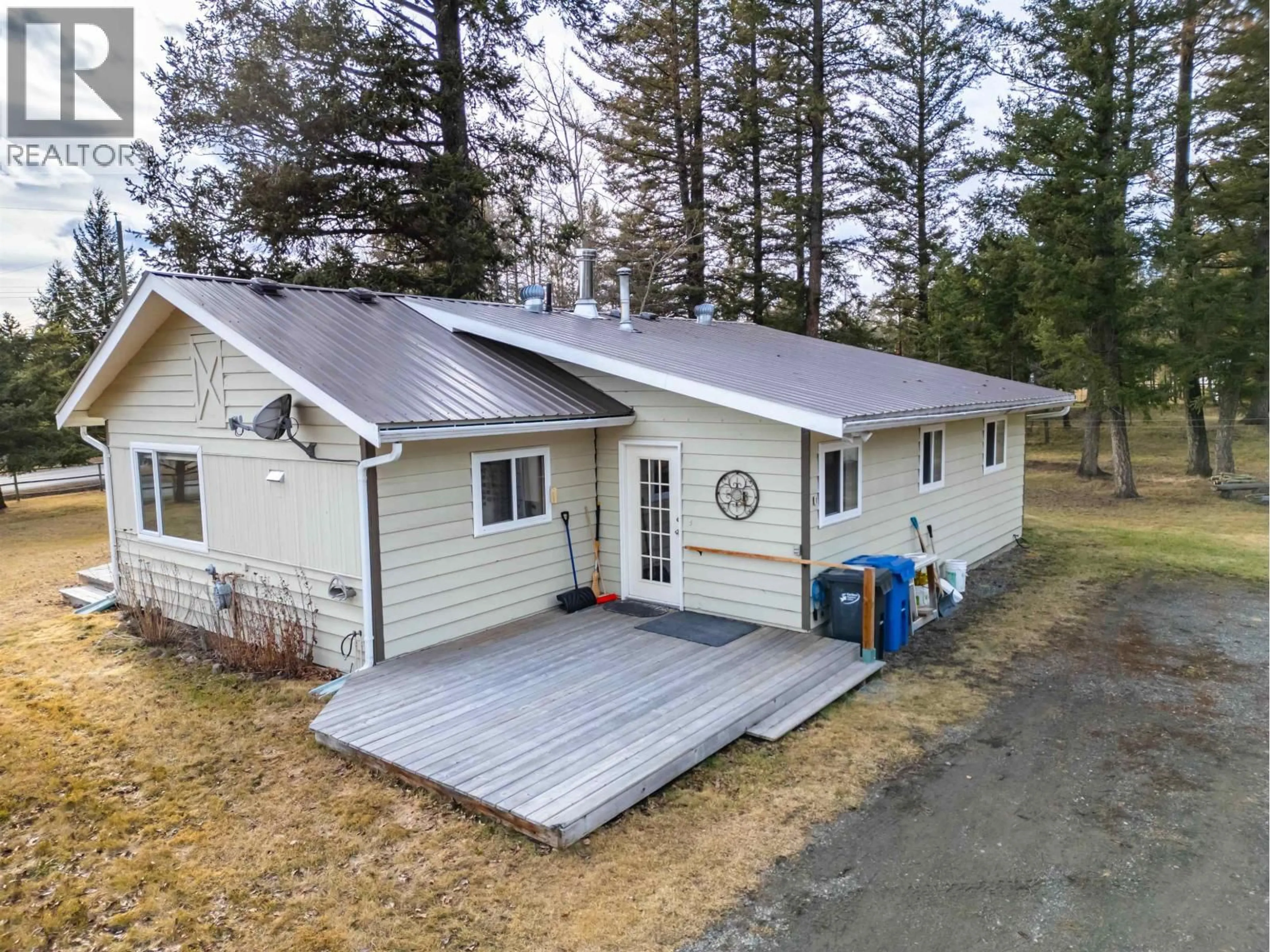 A pic from outside/outdoor area/front of a property/back of a property/a pic from drone, unknown for 4734 KITWANGA DRIVE, 108 Mile Ranch British Columbia V0K2Z0
