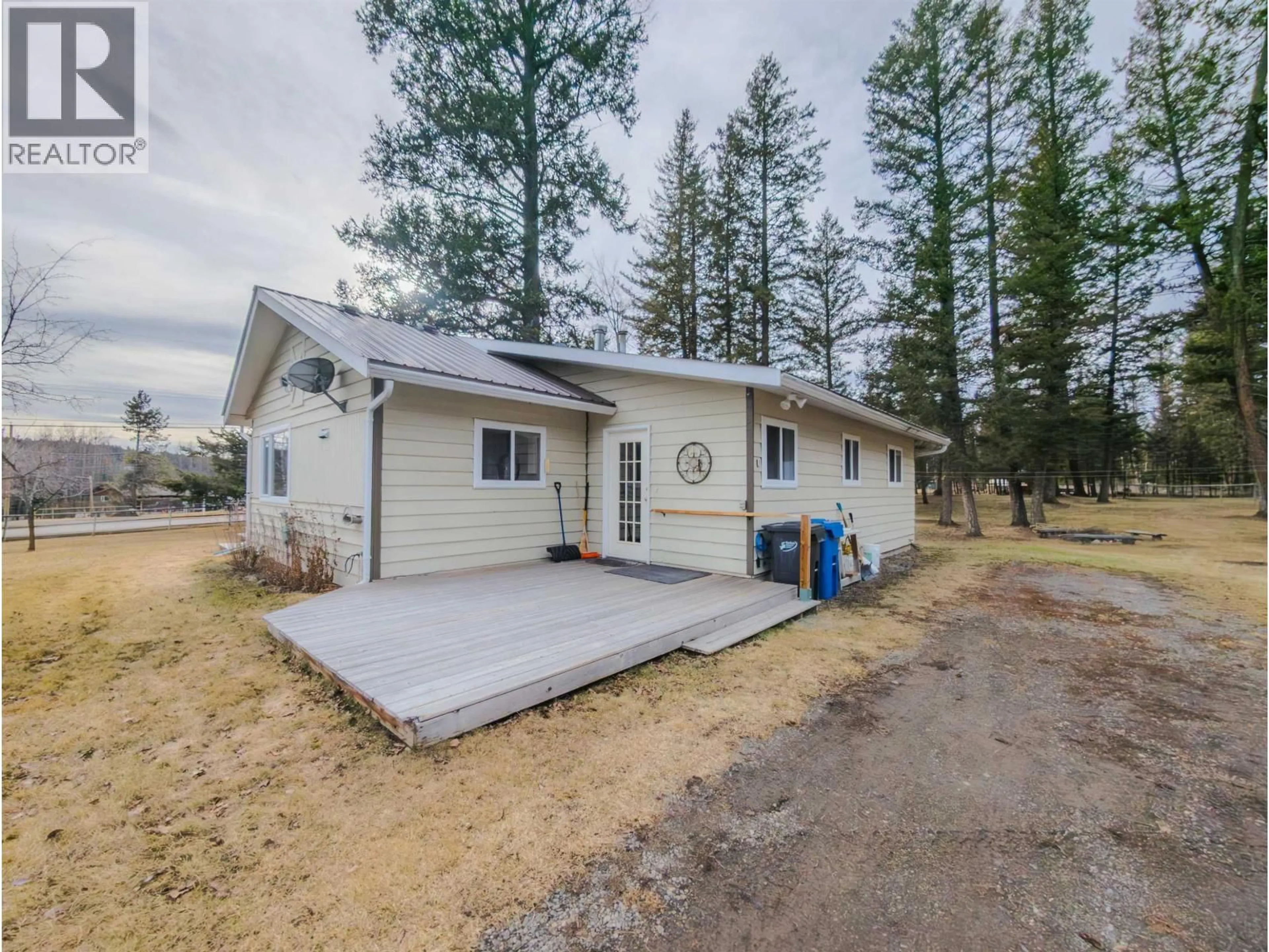 A pic from outside/outdoor area/front of a property/back of a property/a pic from drone, unknown for 4734 KITWANGA DRIVE, 108 Mile Ranch British Columbia V0K2Z0