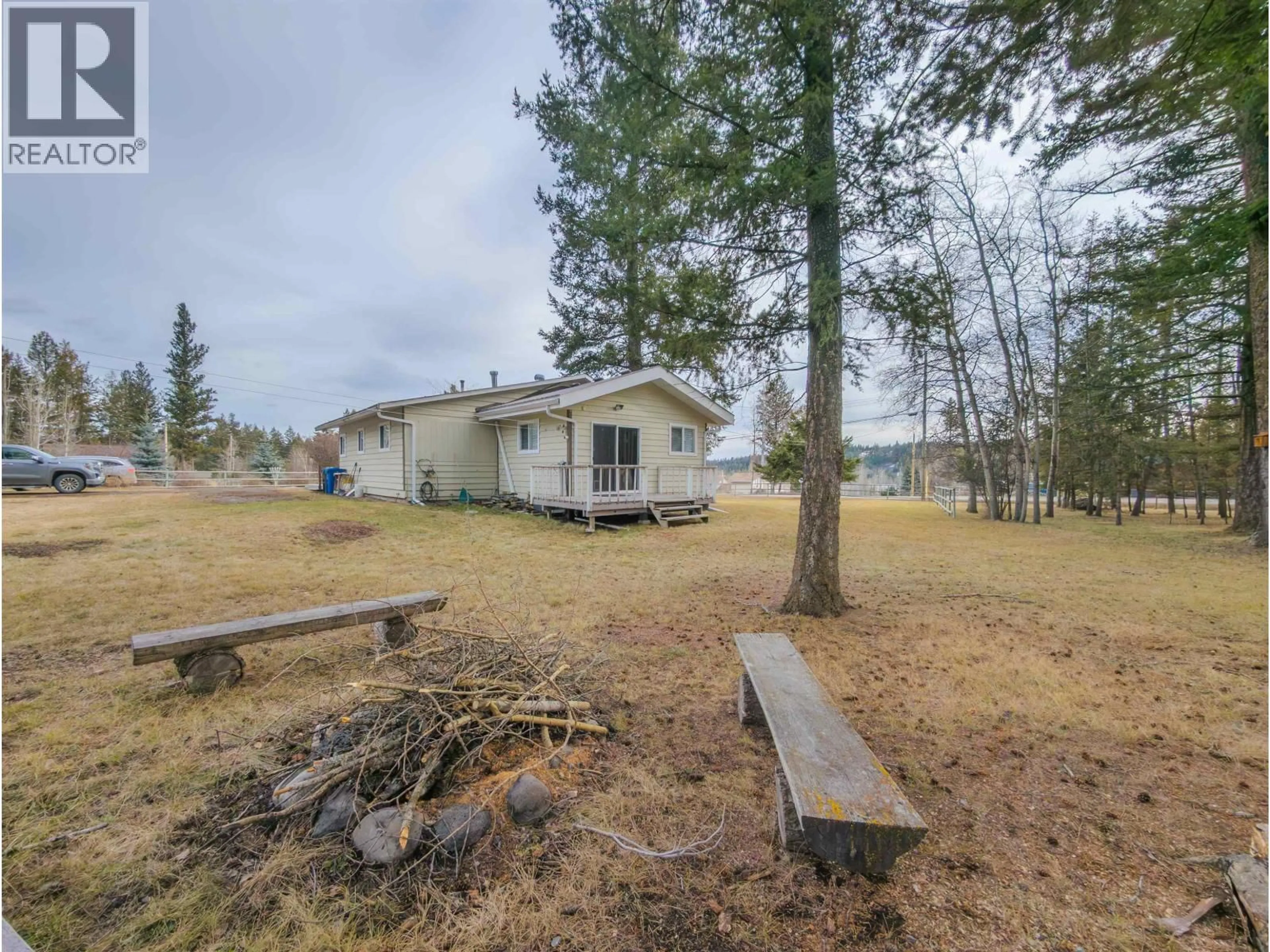 A pic from outside/outdoor area/front of a property/back of a property/a pic from drone, unknown for 4734 KITWANGA DRIVE, 108 Mile Ranch British Columbia V0K2Z0