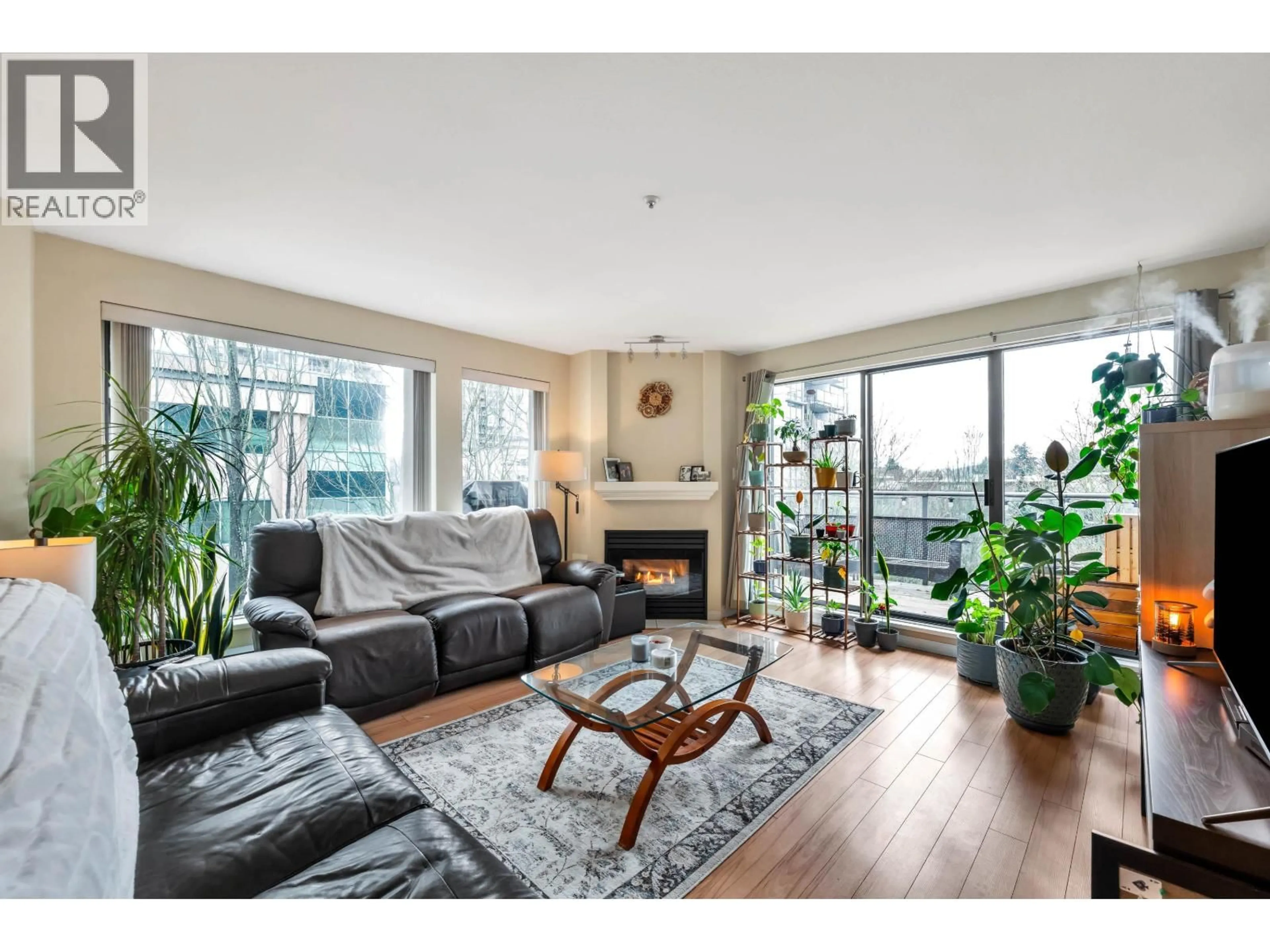 Living room with furniture, wood/laminate floor for 411 - 2968 BURLINGTON DRIVE, Coquitlam British Columbia V3B7N4