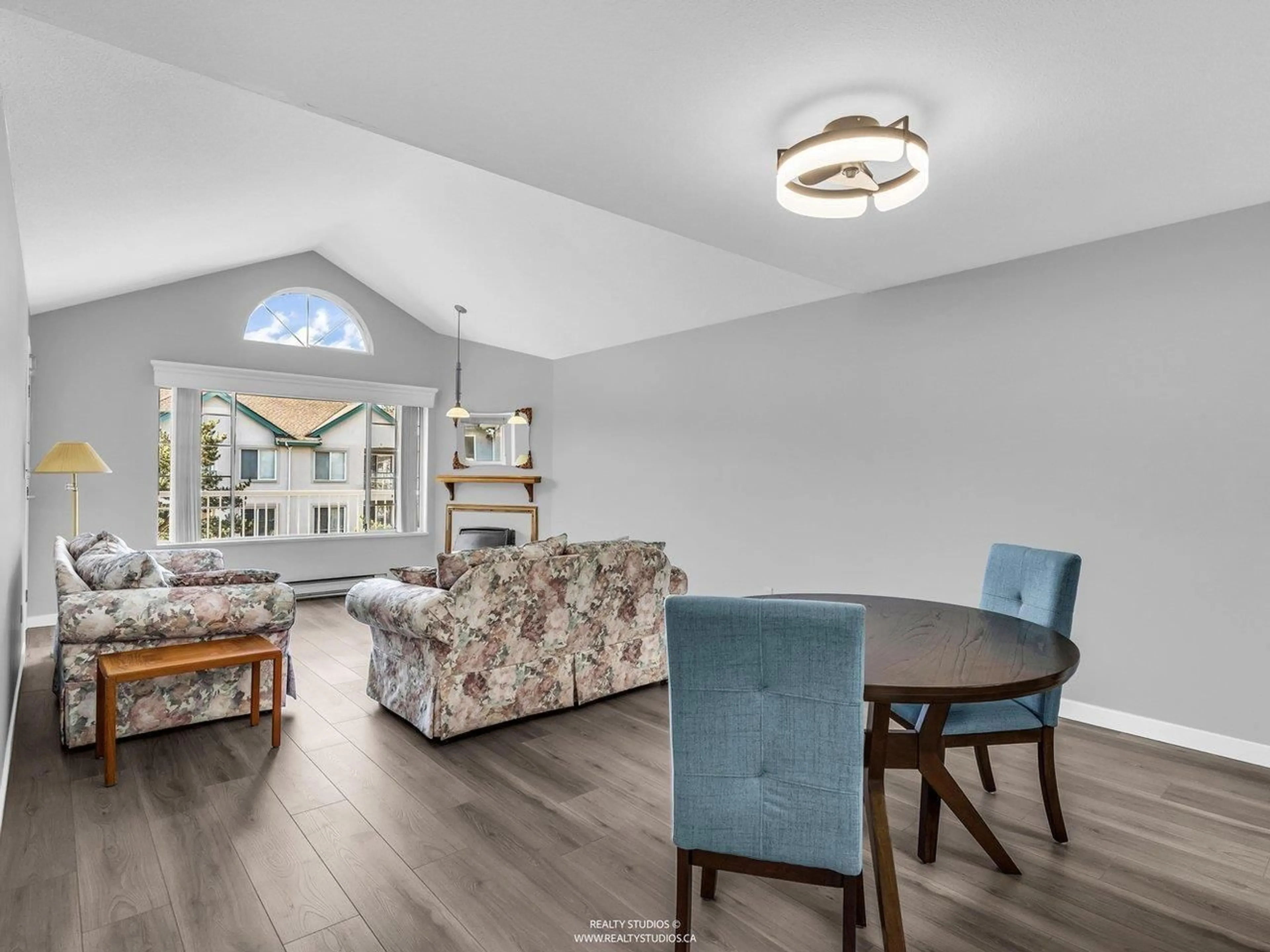 Living room with furniture, wood/laminate floor for 312 - 5375 205 STREET, Langley British Columbia V3A7V7