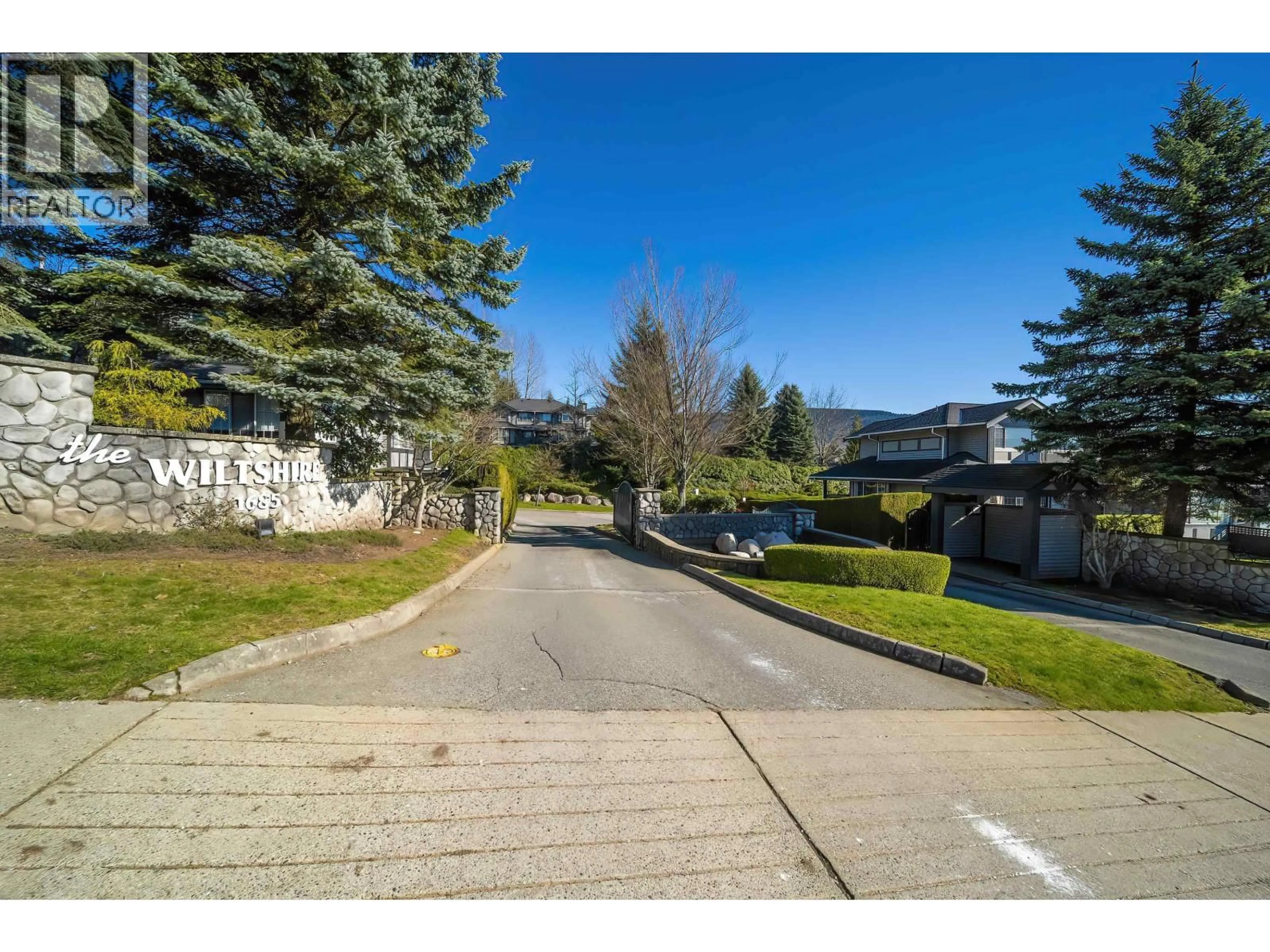 A pic from outside/outdoor area/front of a property/back of a property/a pic from drone, street for 120 - 1685 PINETREE WAY, Coquitlam British Columbia V3E3A1