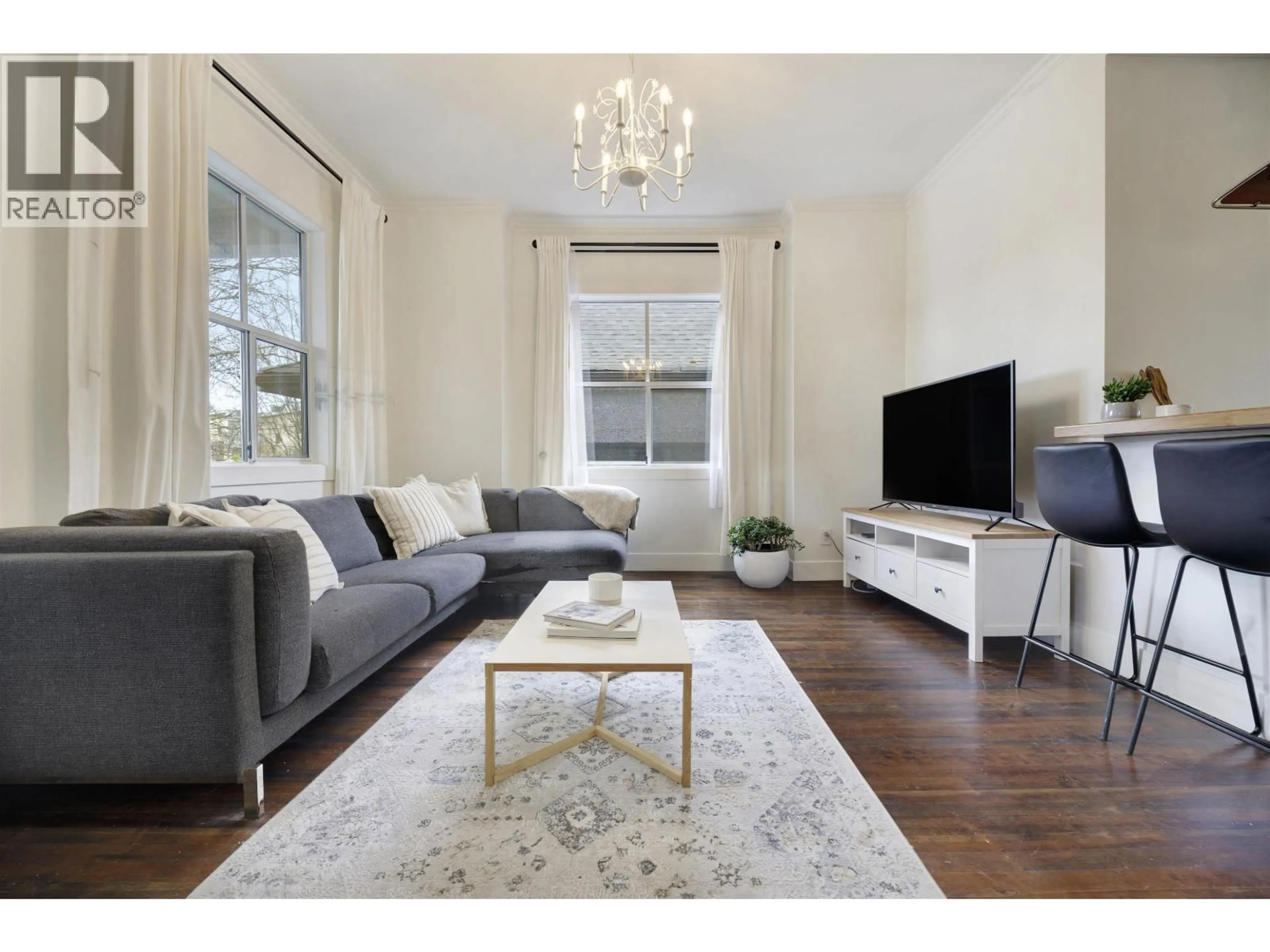 Living room with furniture, wood/laminate floor for 1923 1ST AVENUE, Vancouver British Columbia V5N1B3