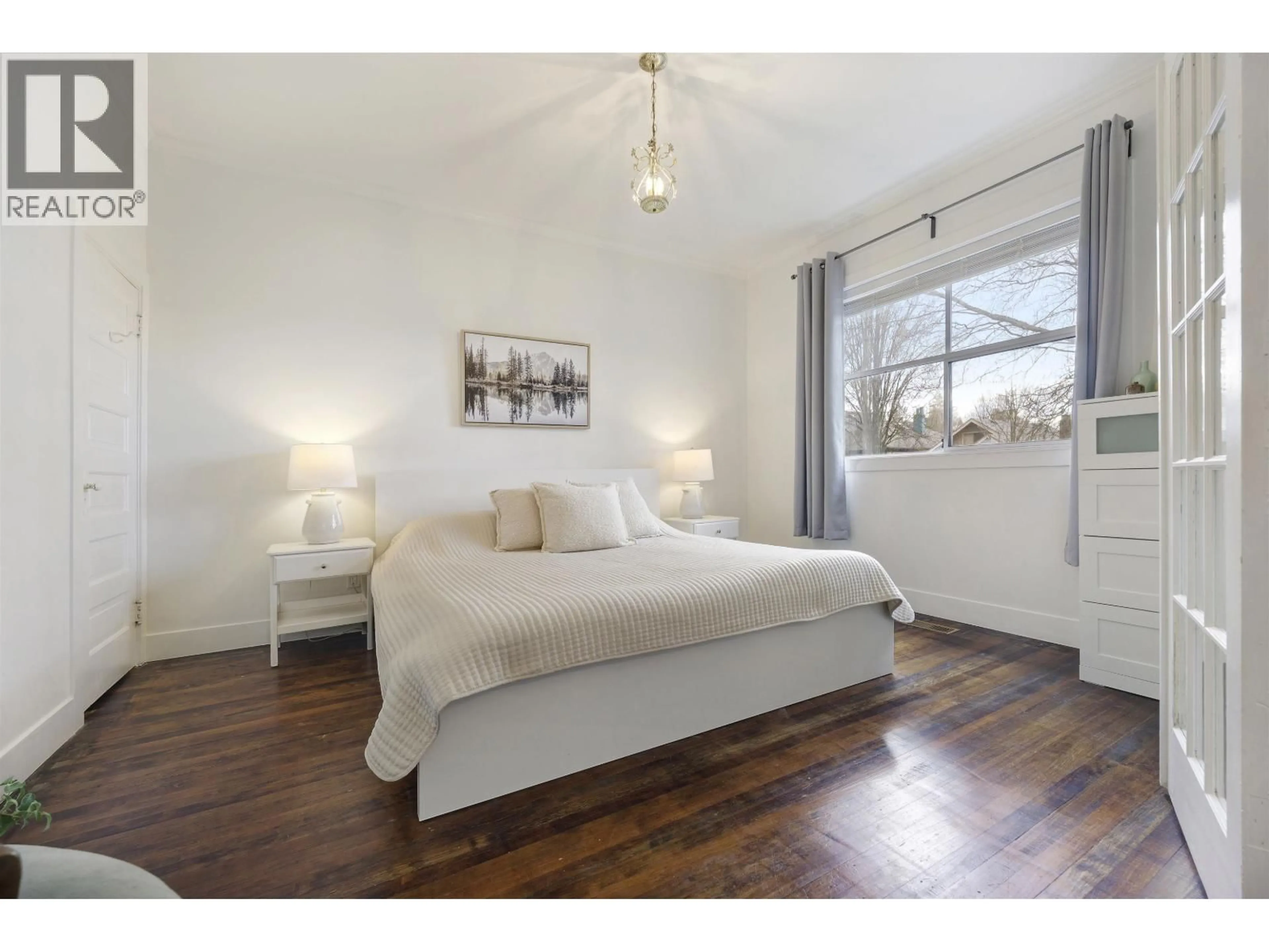 Bedroom with bed, wood/laminate floor for 1923 1ST AVENUE, Vancouver British Columbia V5N1B3