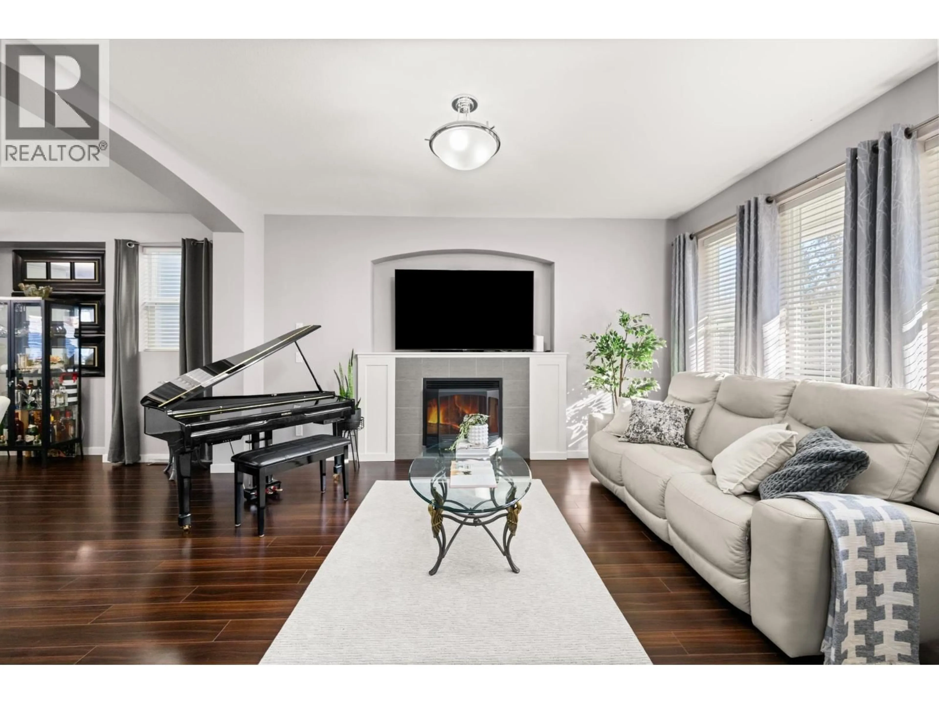 Living room with furniture, wood/laminate floor for 24235 102 AVENUE, Maple Ridge British Columbia V2W1X8