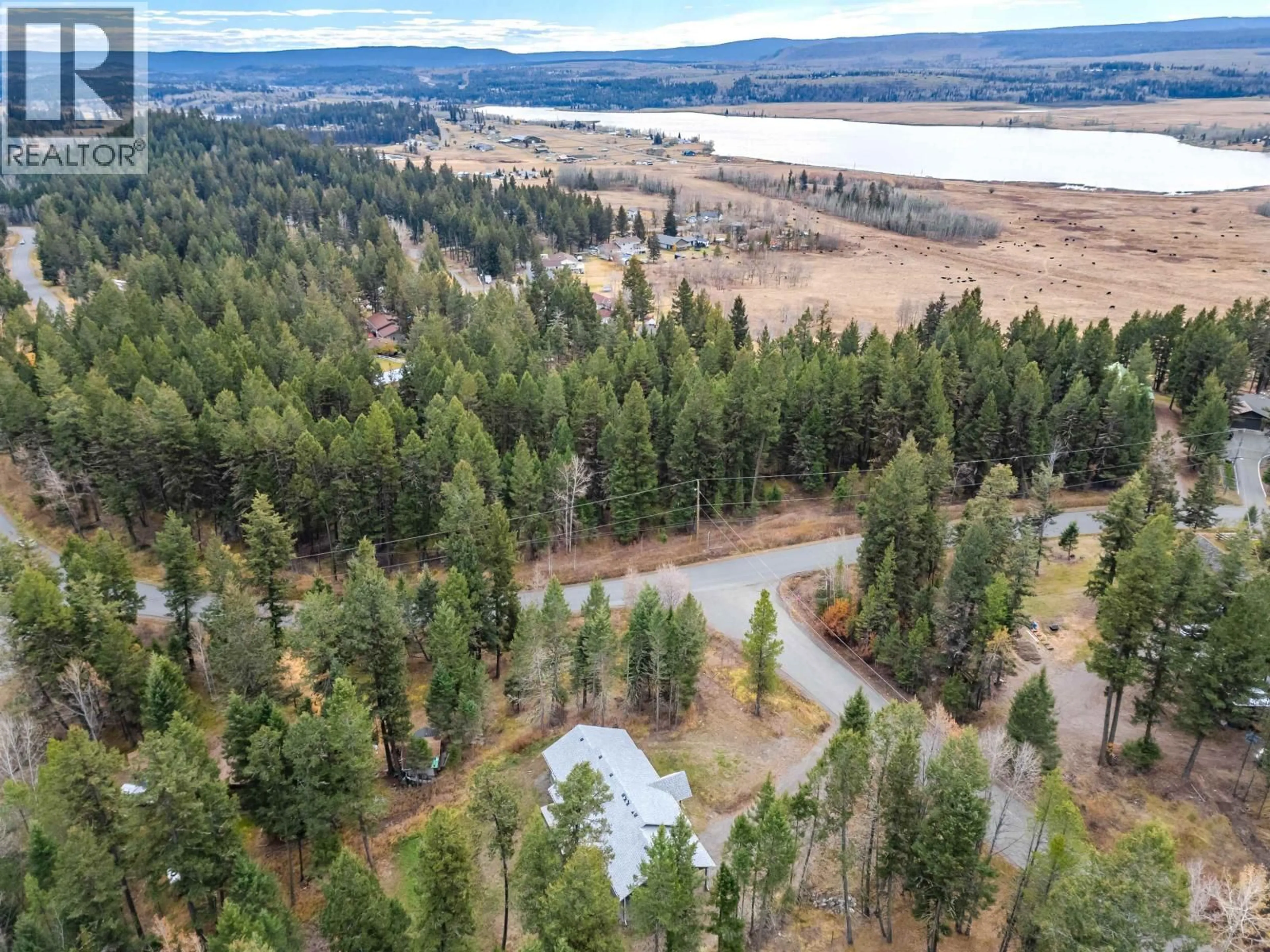 A pic from outside/outdoor area/front of a property/back of a property/a pic from drone, forest/trees view for 5025 KYLLO ROAD, 108 Mile Ranch British Columbia V0K2Z0
