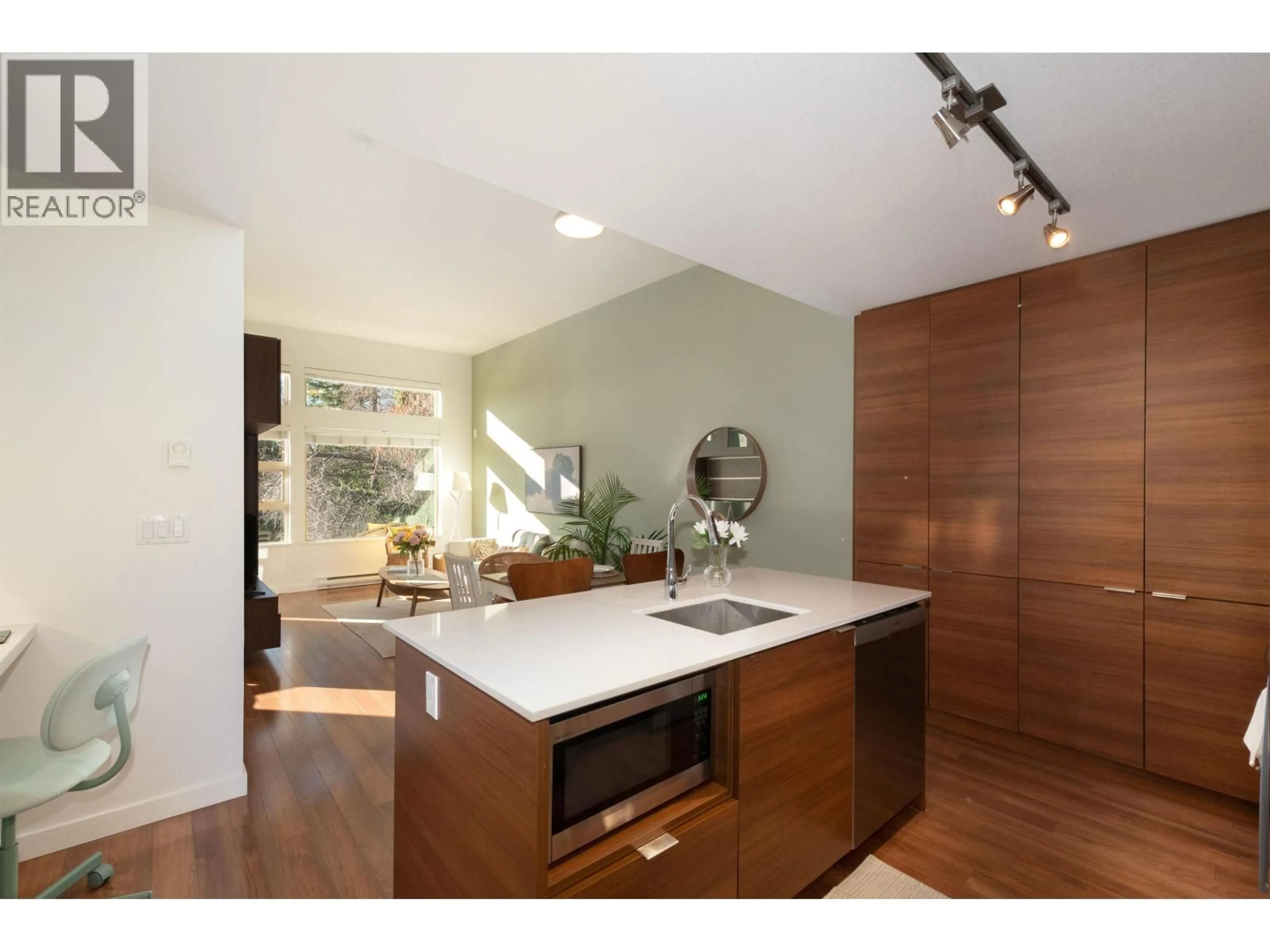Open concept kitchen, wood/laminate floor for 507 - 1677 LLOYD AVENUE, North Vancouver British Columbia V7P0B1