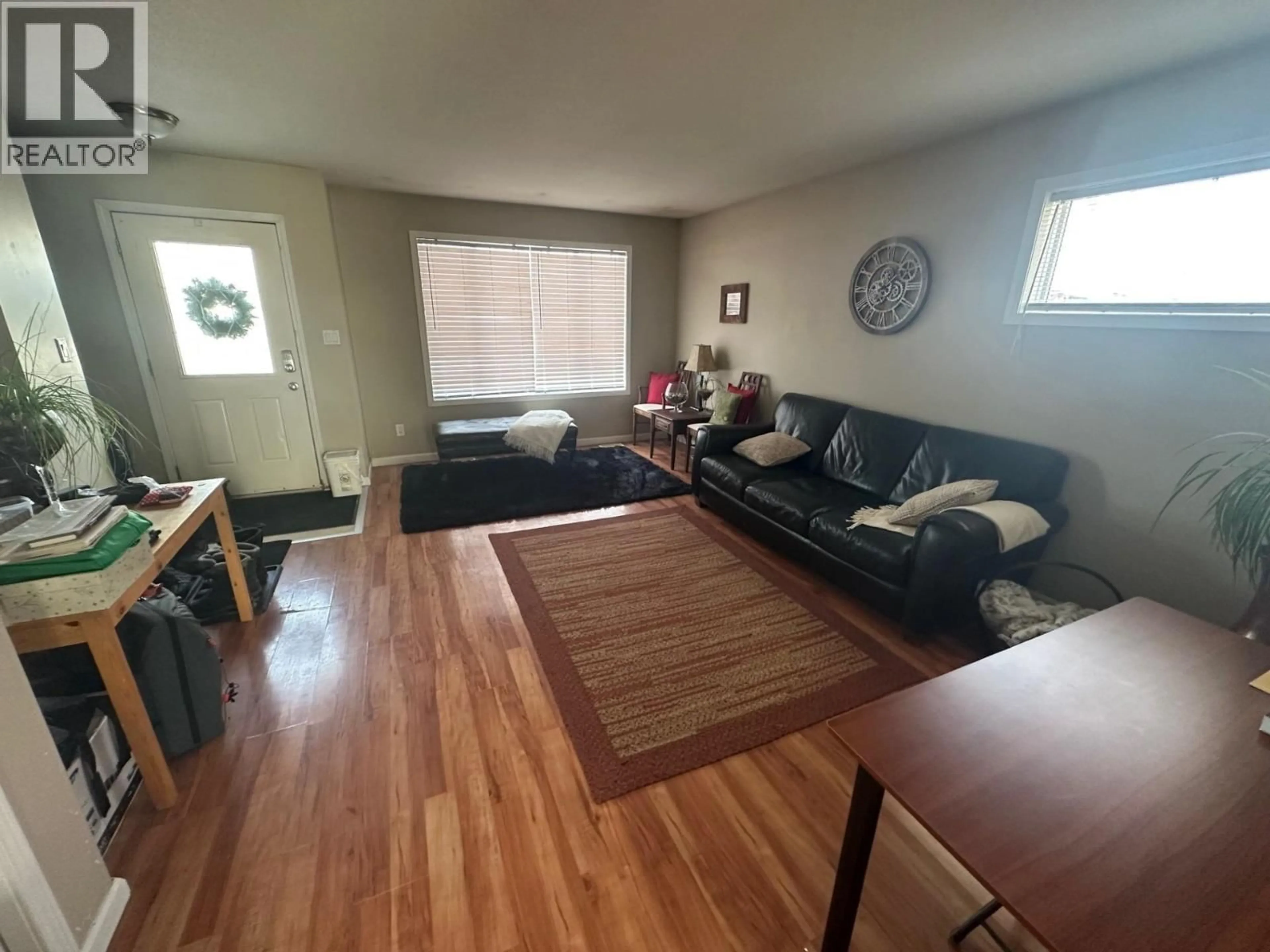 Living room with furniture, wood/laminate floor for 10303 98 AVENUE, Fort St. John British Columbia V1J0B1