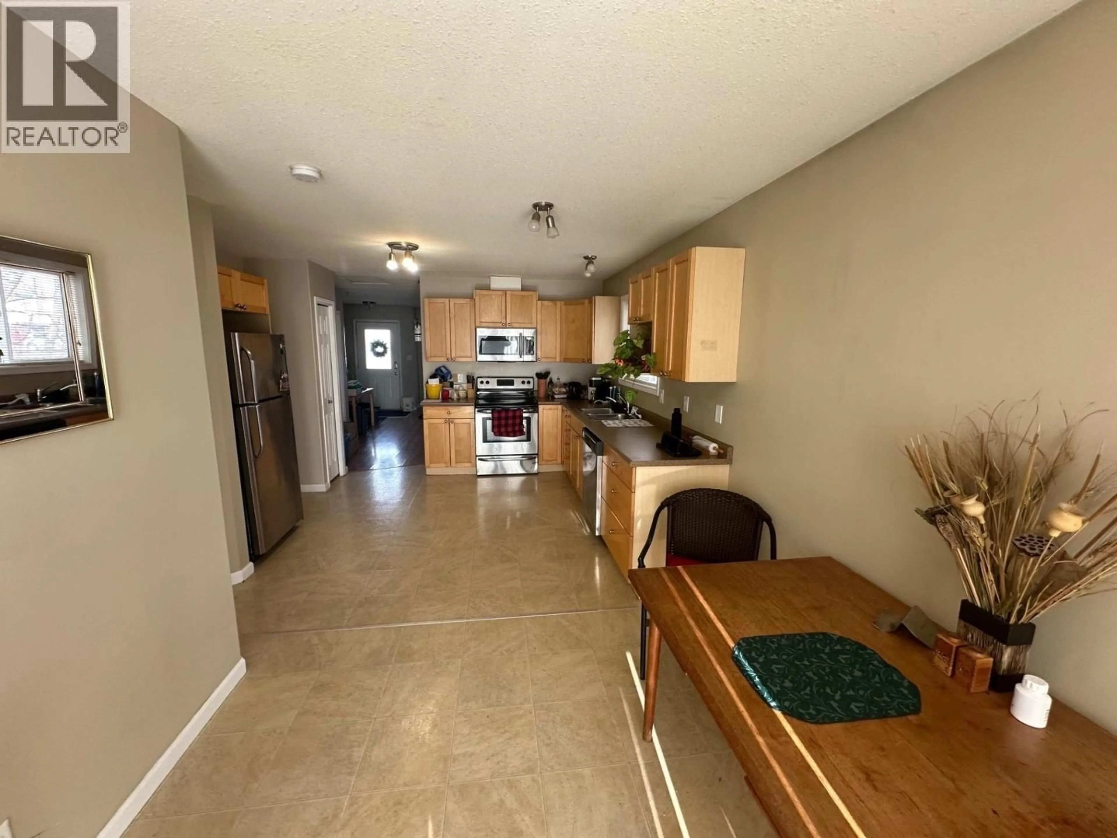 Open concept kitchen, ceramic/tile floor for 10303 98 AVENUE, Fort St. John British Columbia V1J0B1