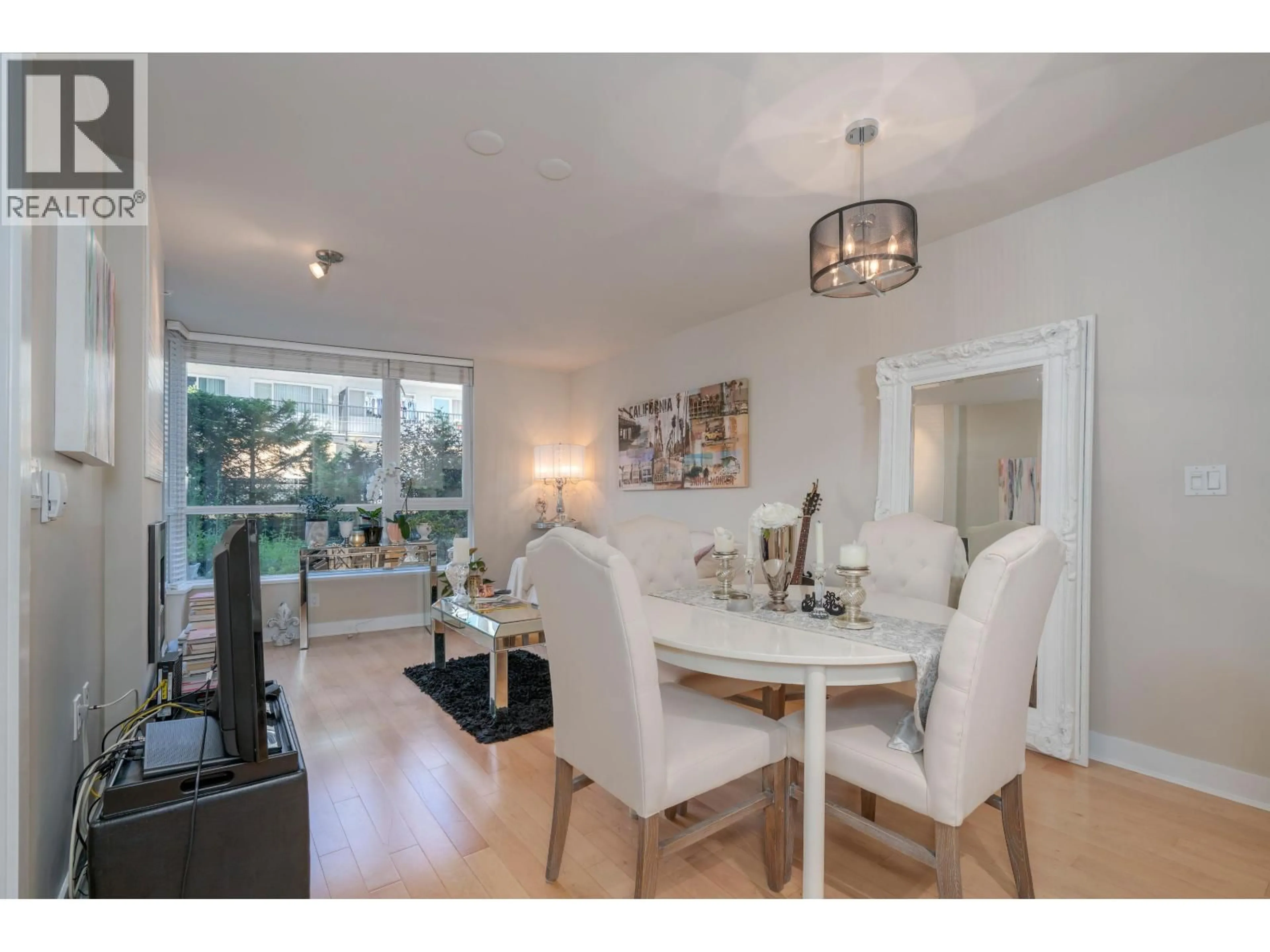 Dining room, wood/laminate floor for 302 - 160 3RD STREET, North Vancouver British Columbia V7M0A9