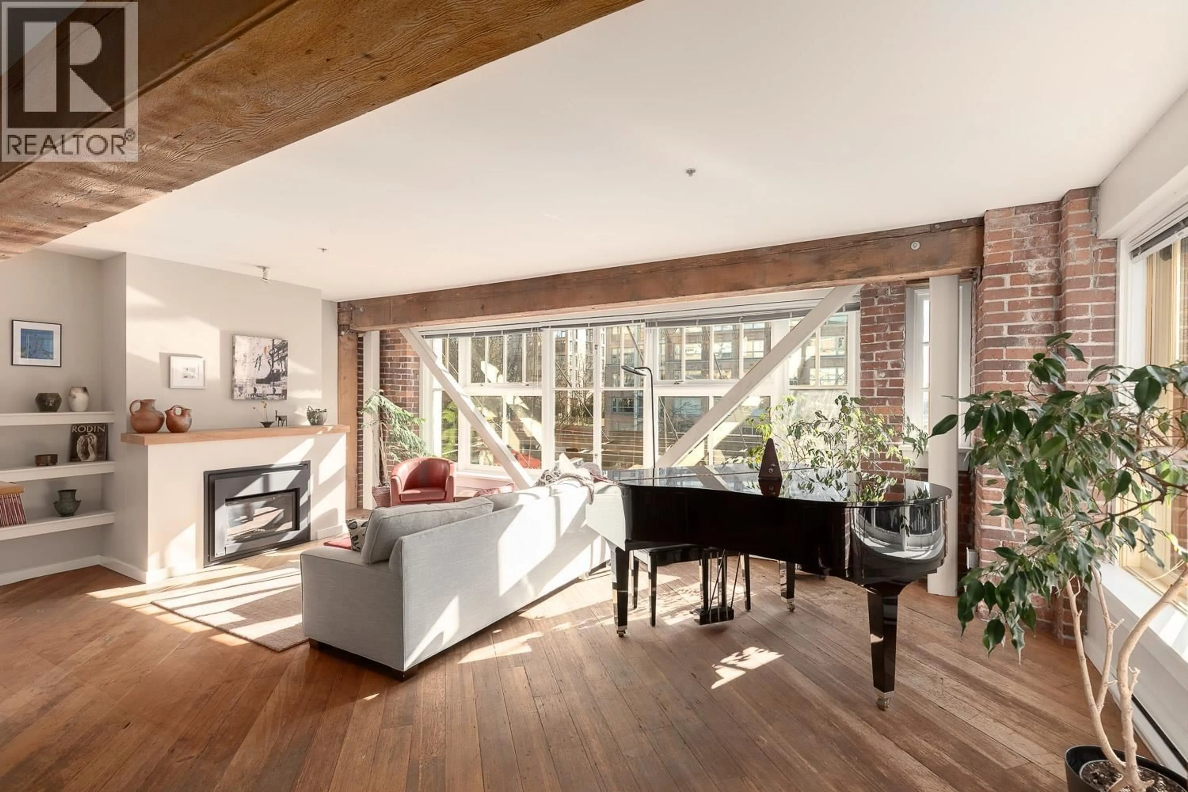 Living room with furniture, wood/laminate floor for 207 - 1178 HAMILTON STREET, Vancouver British Columbia V6B2S2