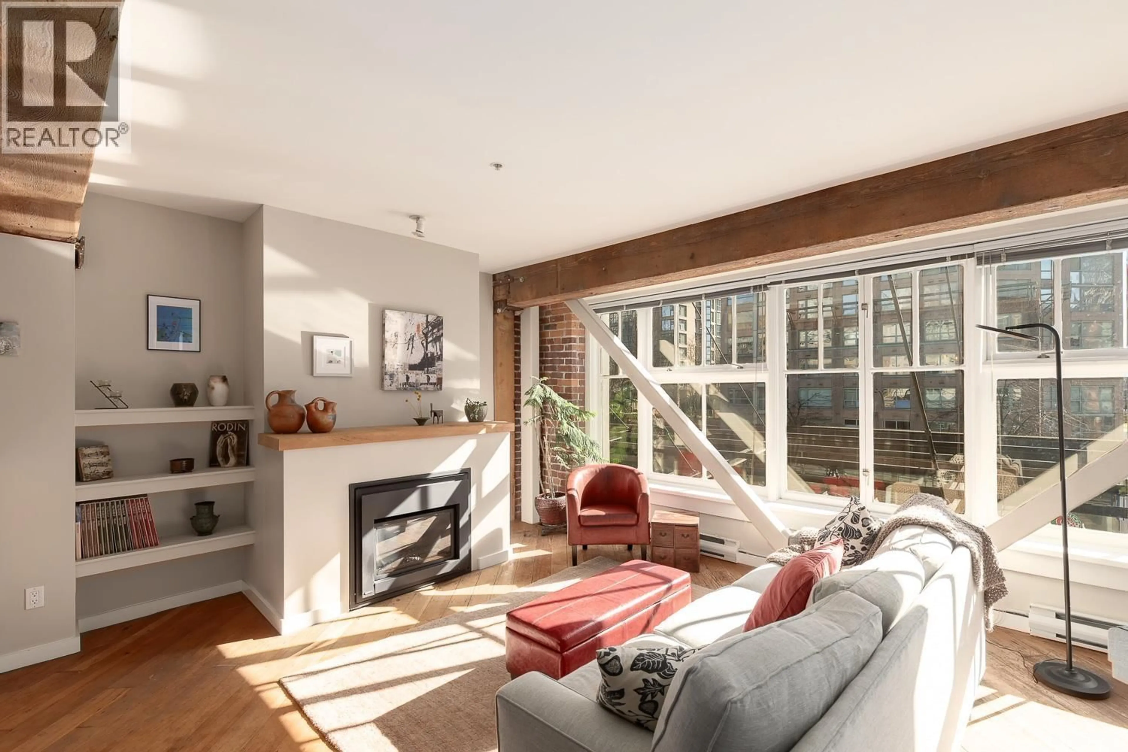 Living room with furniture, wood/laminate floor for 207 - 1178 HAMILTON STREET, Vancouver British Columbia V6B2S2