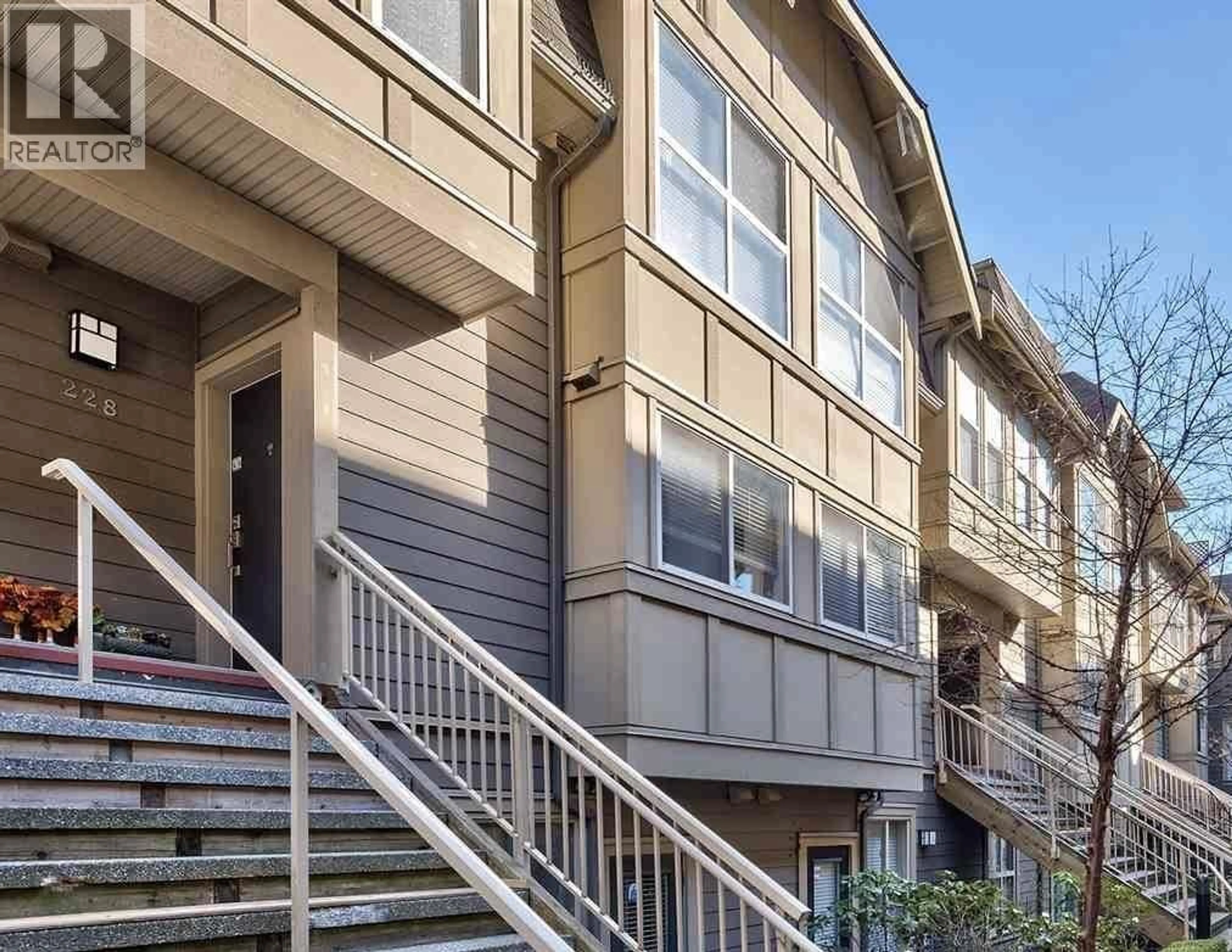 Home with vinyl exterior material, street for 228 - 2108 ROWLAND STREET, Port Coquitlam British Columbia V3C0C1