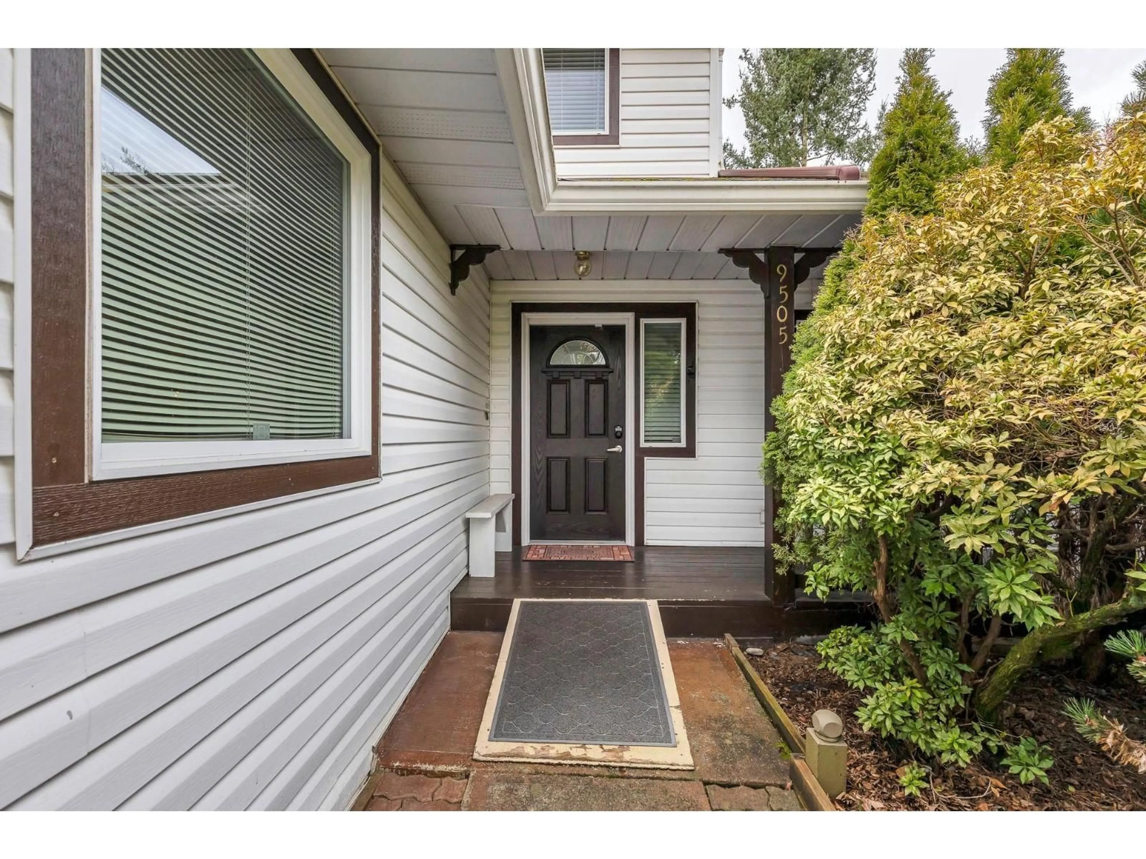 Home with vinyl exterior material, street for 9505 161 STREET, Surrey British Columbia V4N2P3