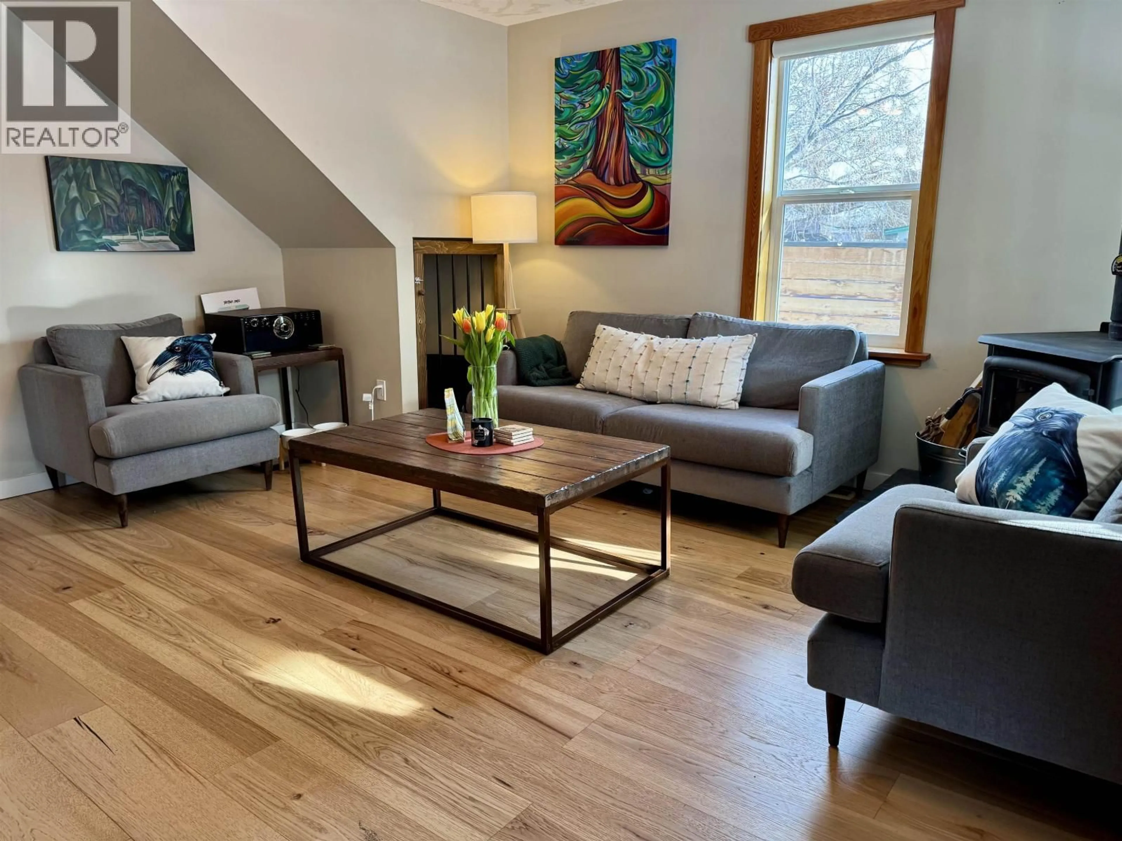 Living room with furniture, wood/laminate floor for 3936 1ST AVENUE, Smithers British Columbia V0J2N0