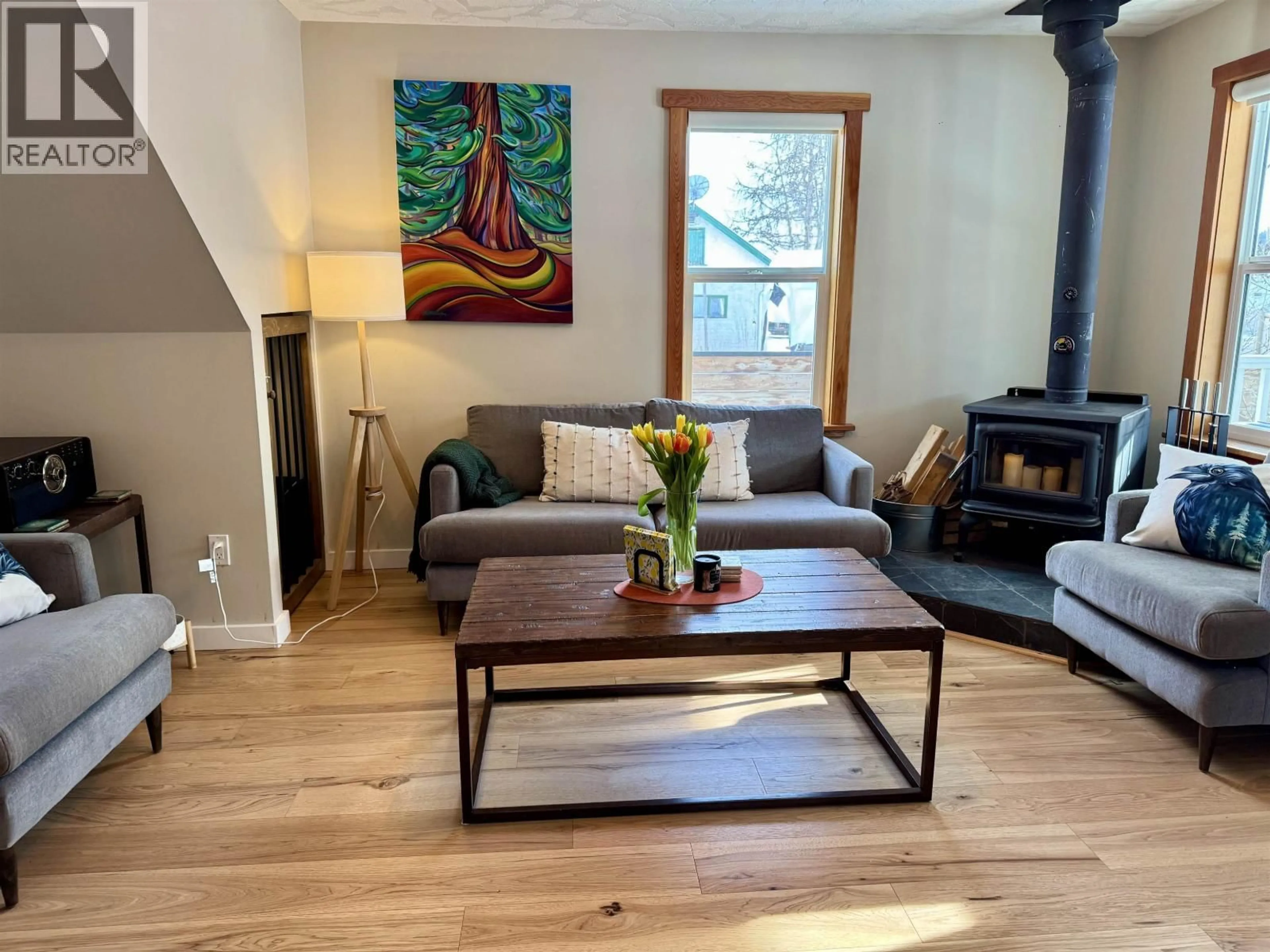 Living room with furniture, wood/laminate floor for 3936 1ST AVENUE, Smithers British Columbia V0J2N0
