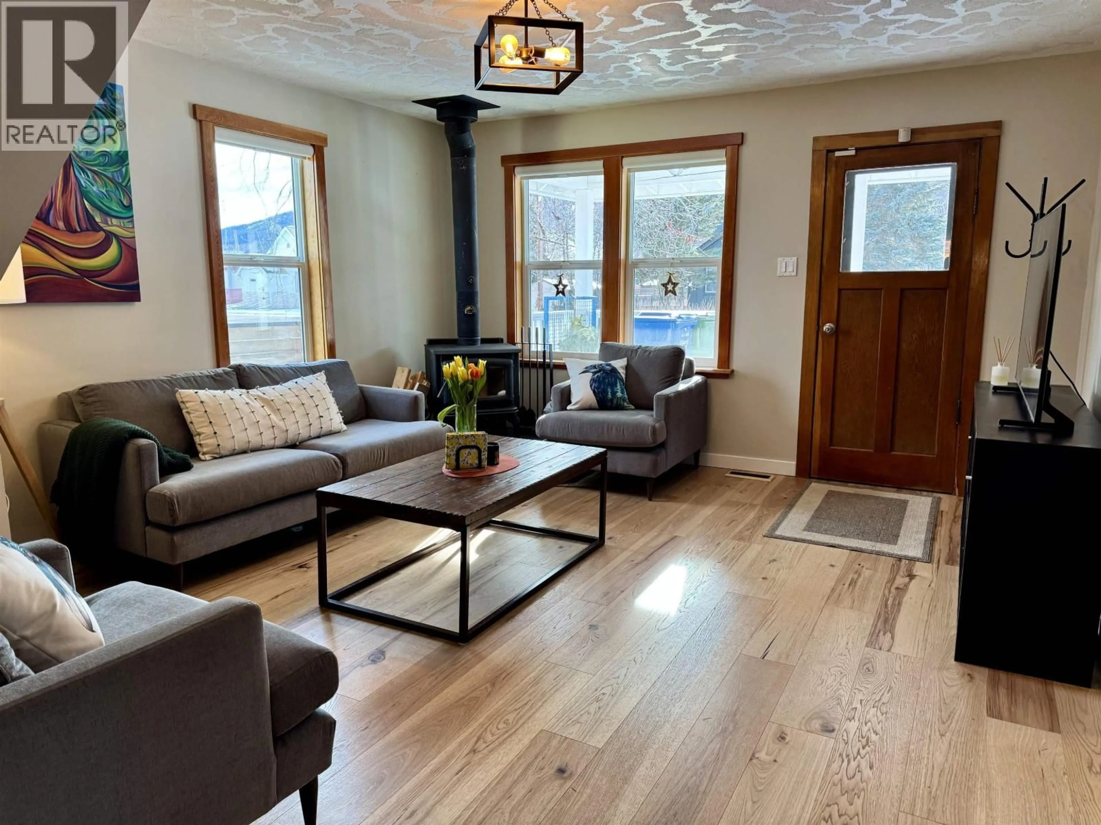 Living room with furniture, wood/laminate floor for 3936 1ST AVENUE, Smithers British Columbia V0J2N0
