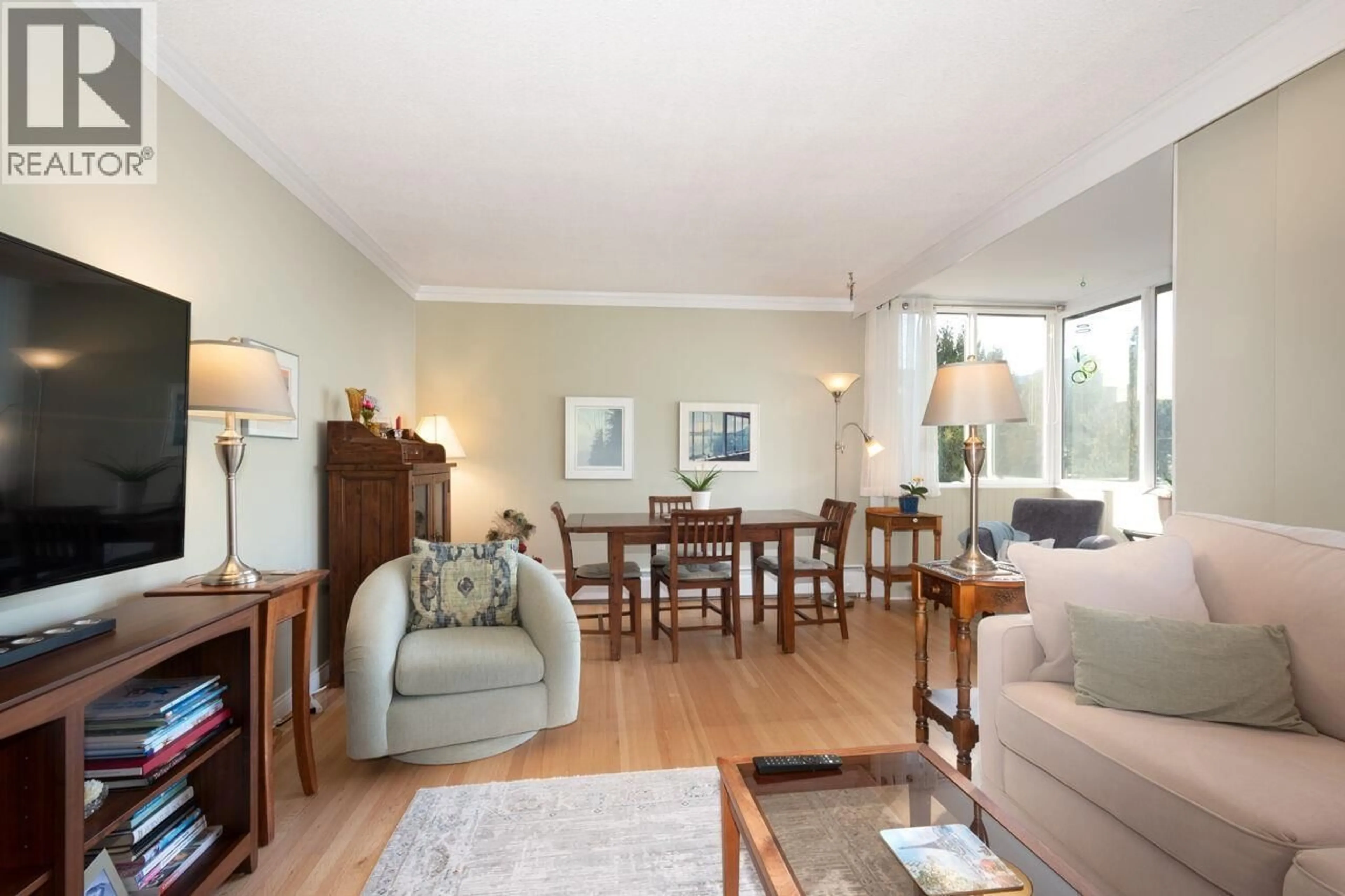 Living room with furniture, wood/laminate floor for 505 - 1425 ESQUIMALT AVENUE, West Vancouver British Columbia V7T1L1